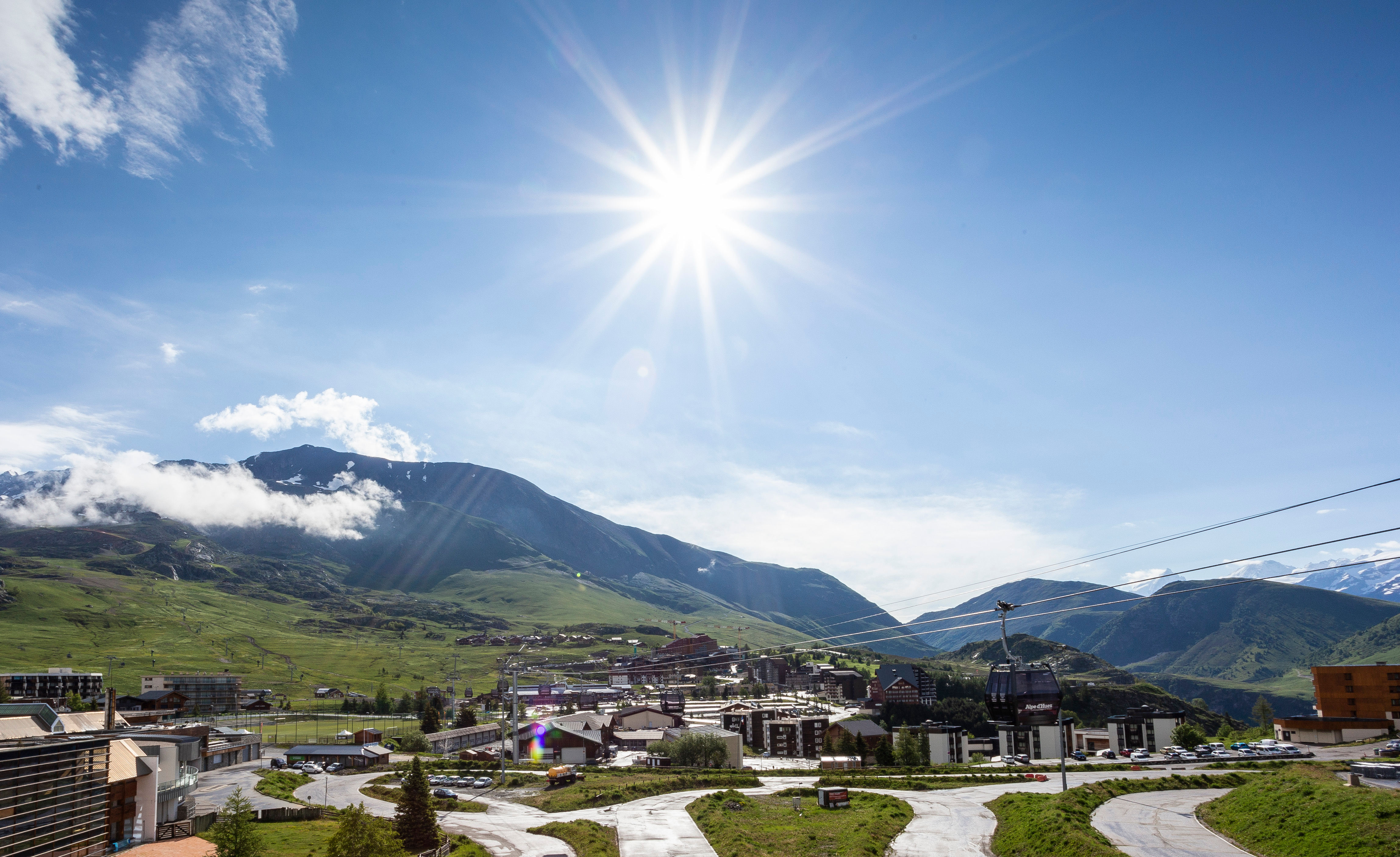 image Expansive views over green hills and blue skies from your sunny alpine location.