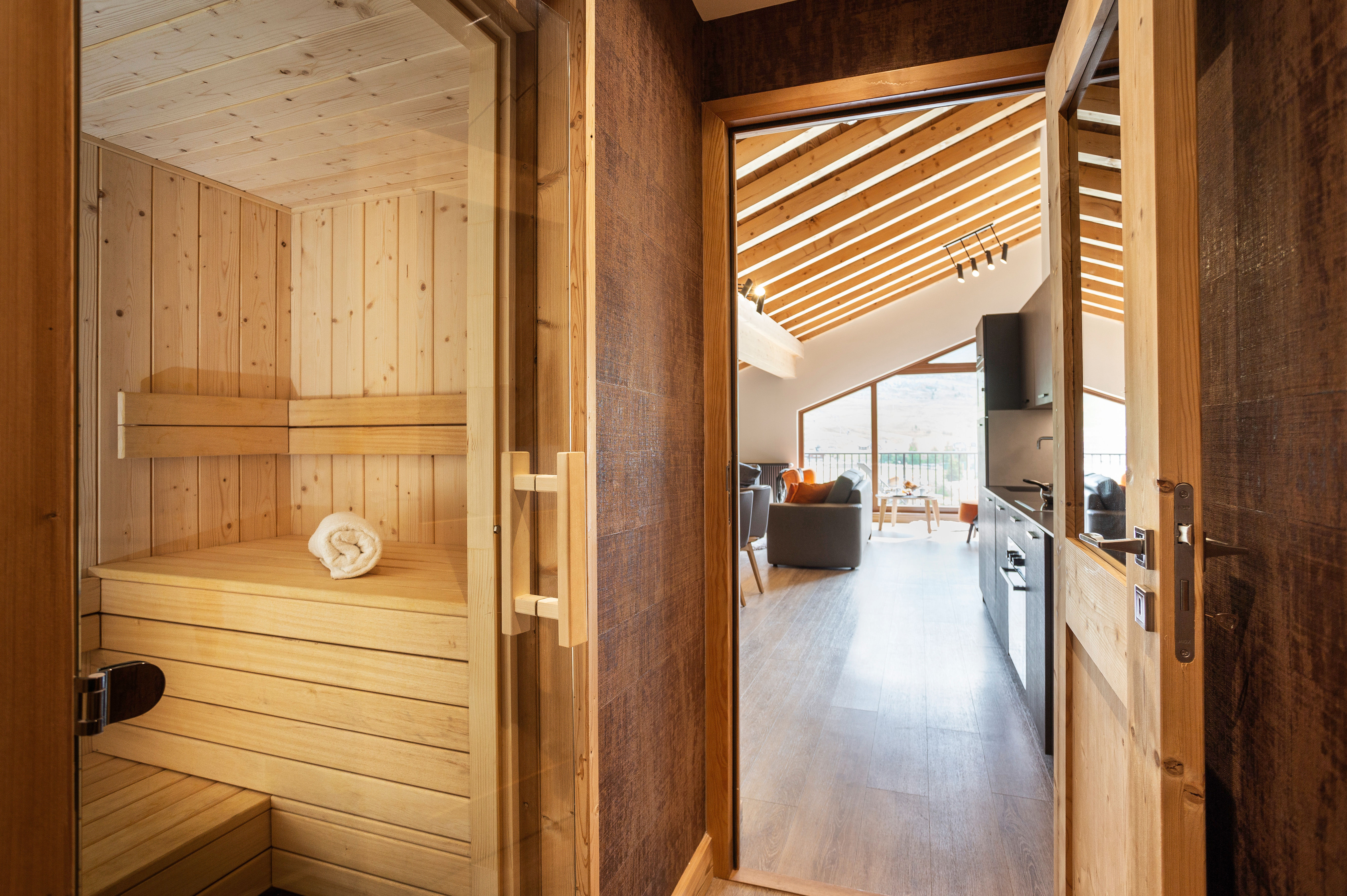 image Warm wood-panelled sauna offering a serene space to unwind after a day in the mountains.