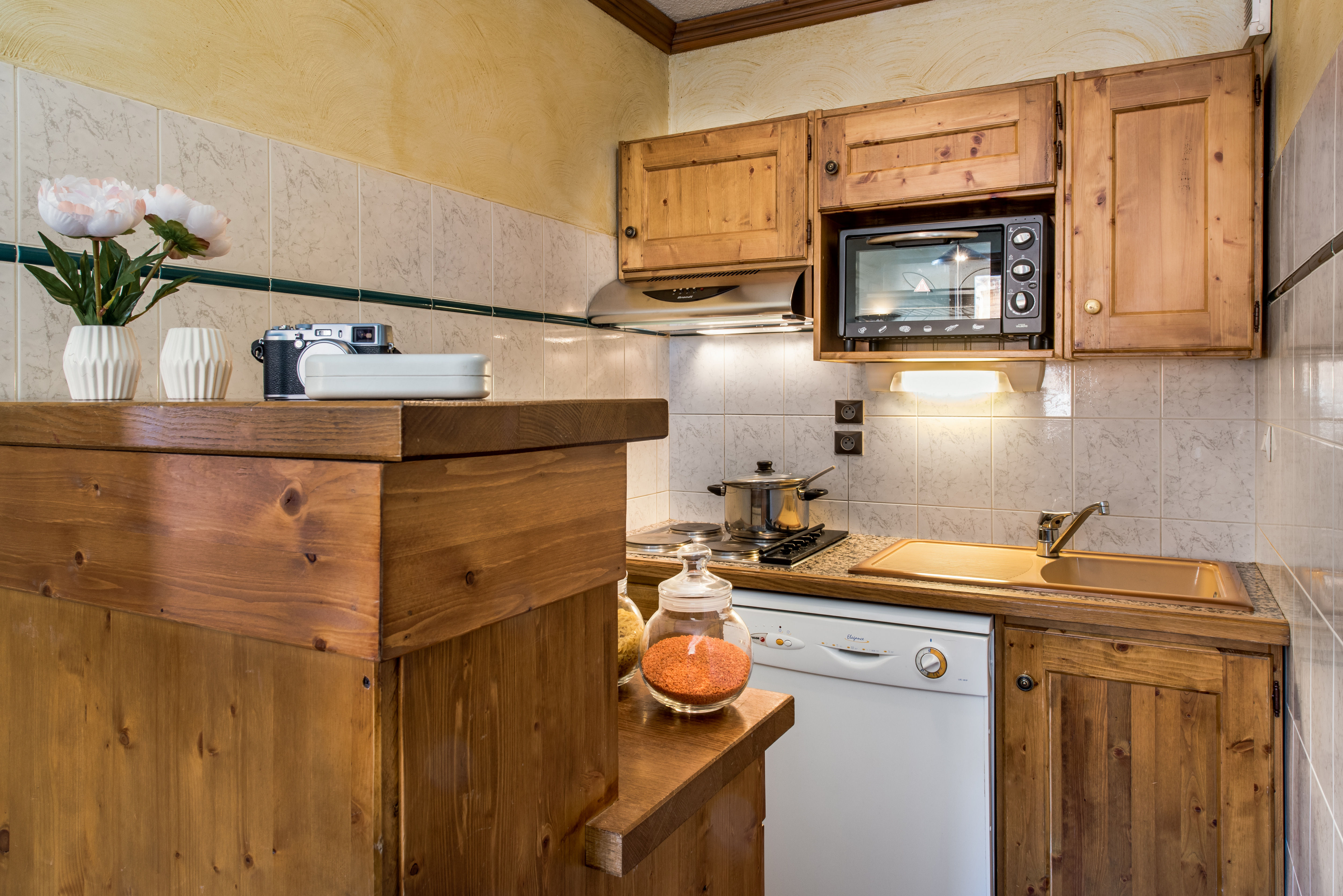 image Fully equipped kitchenette with microwave, stove, and all essentials for easy mealtime prep.
