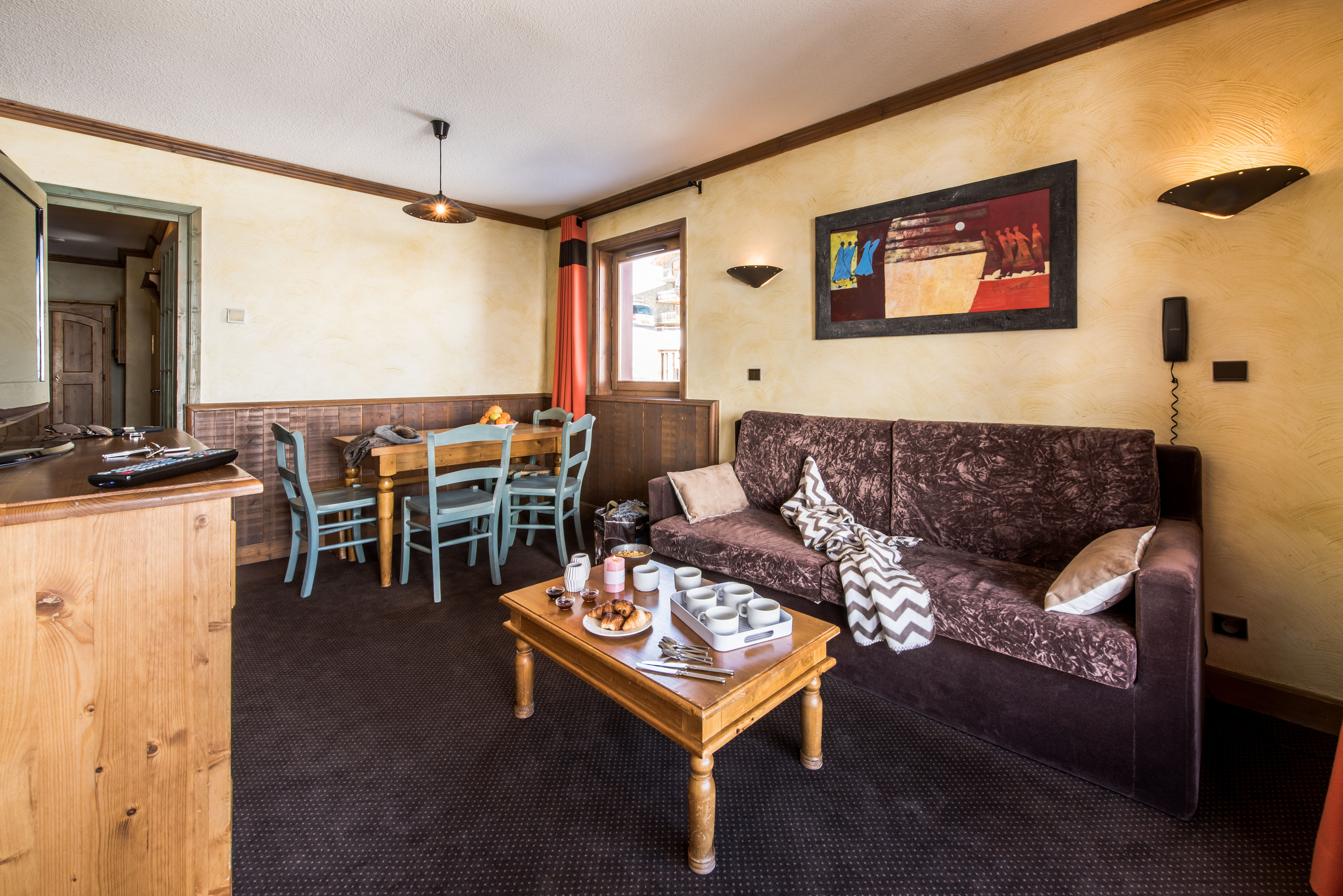 image Living area with sofa bed and dining space — perfect for relaxing or accommodating extra guests.
