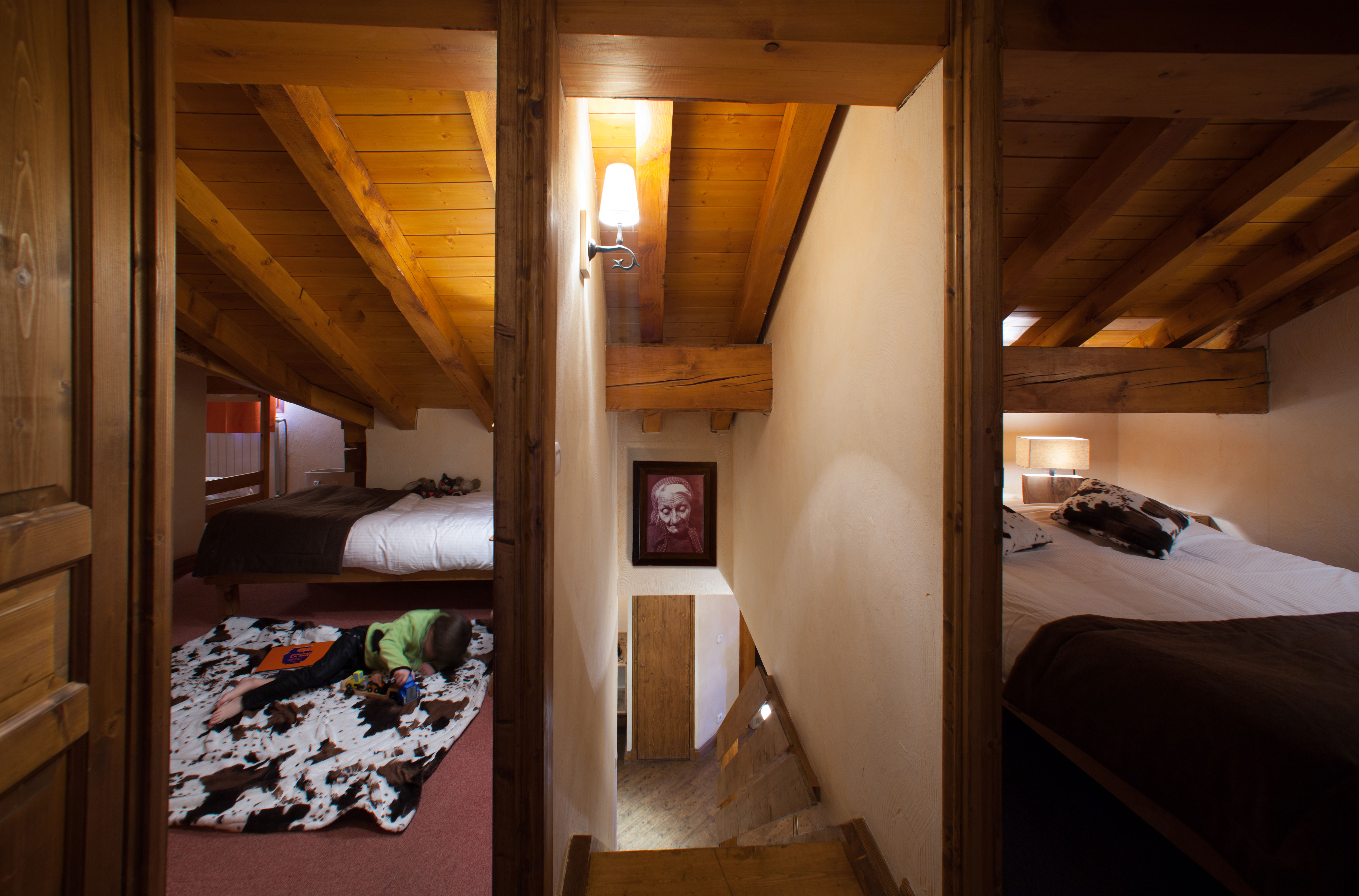 image Cozy cabin-style nook with bunk beds, great for kids or extra guests in this duplex layout.