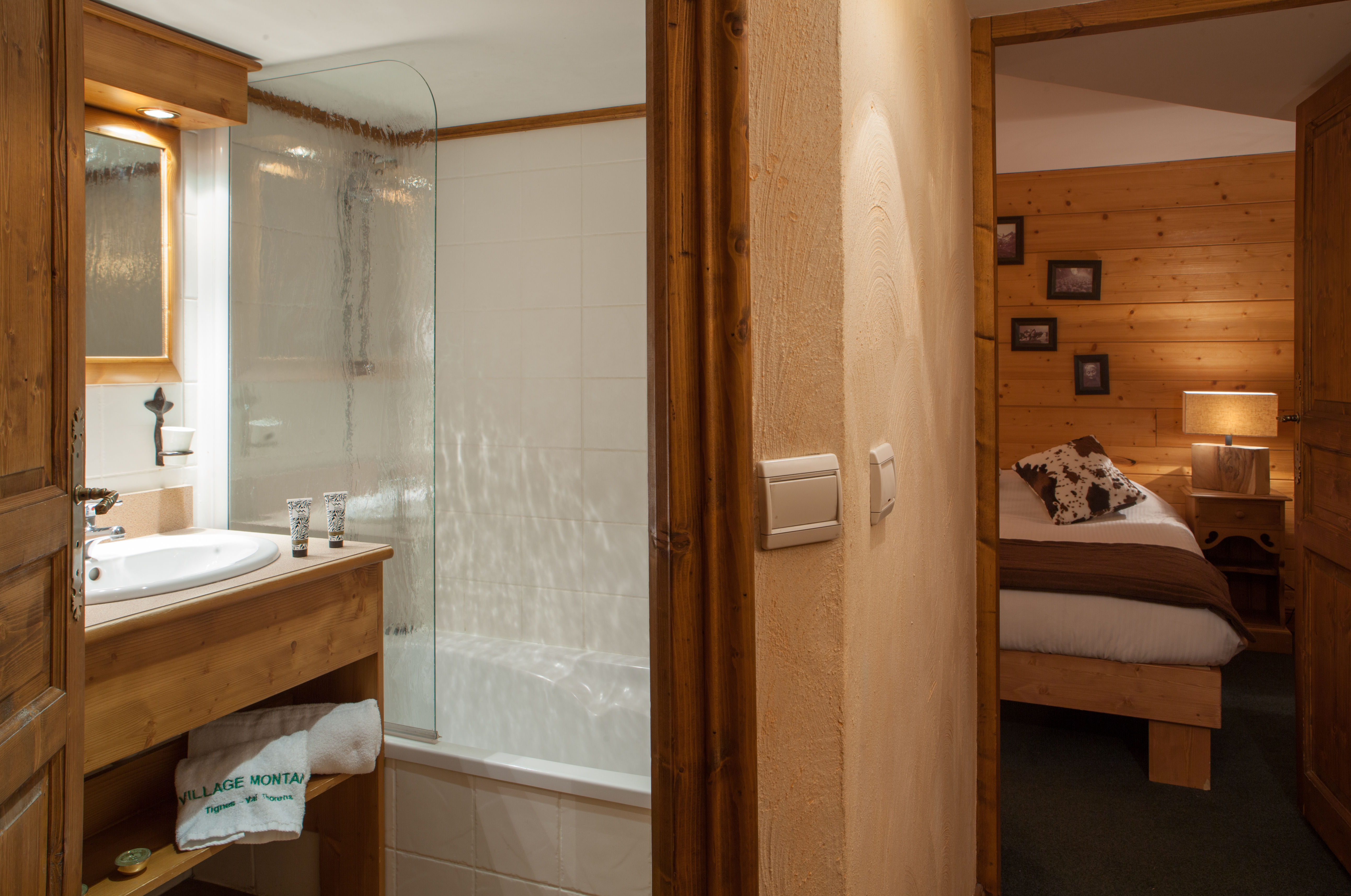 image Modern bathroom with walk-in shower and direct access to the master bedroom.