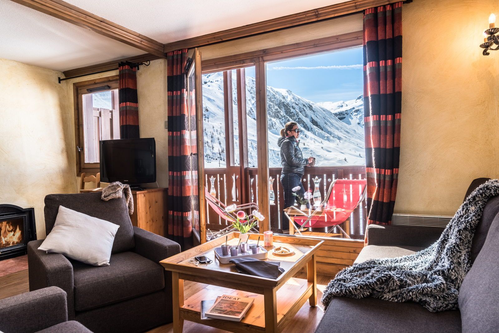 image Living area with a balcony and mountain backdrop — step outside and take in the alpine panorama