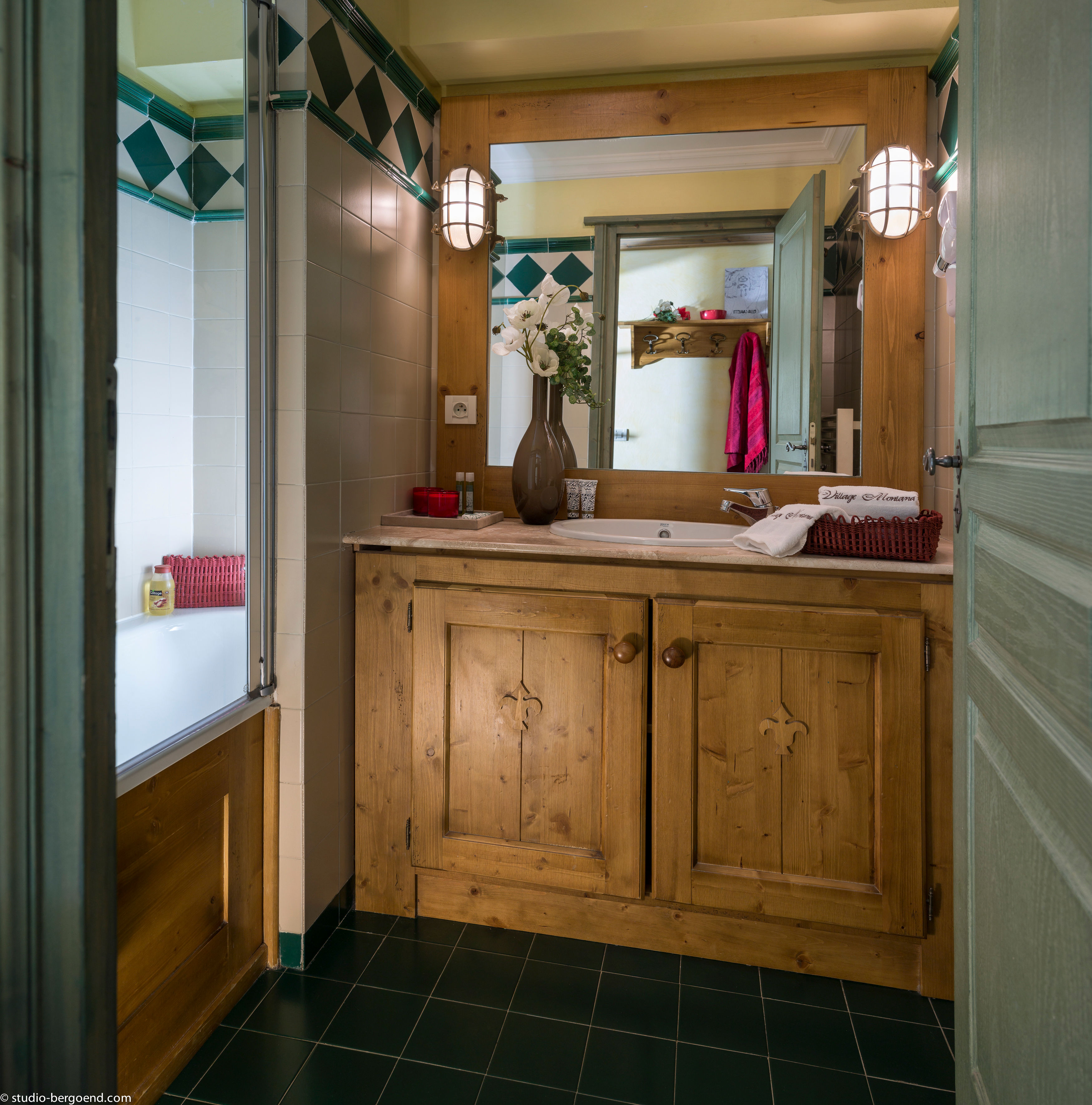 image Modern bathroom with wooden vanity and bright lighting.