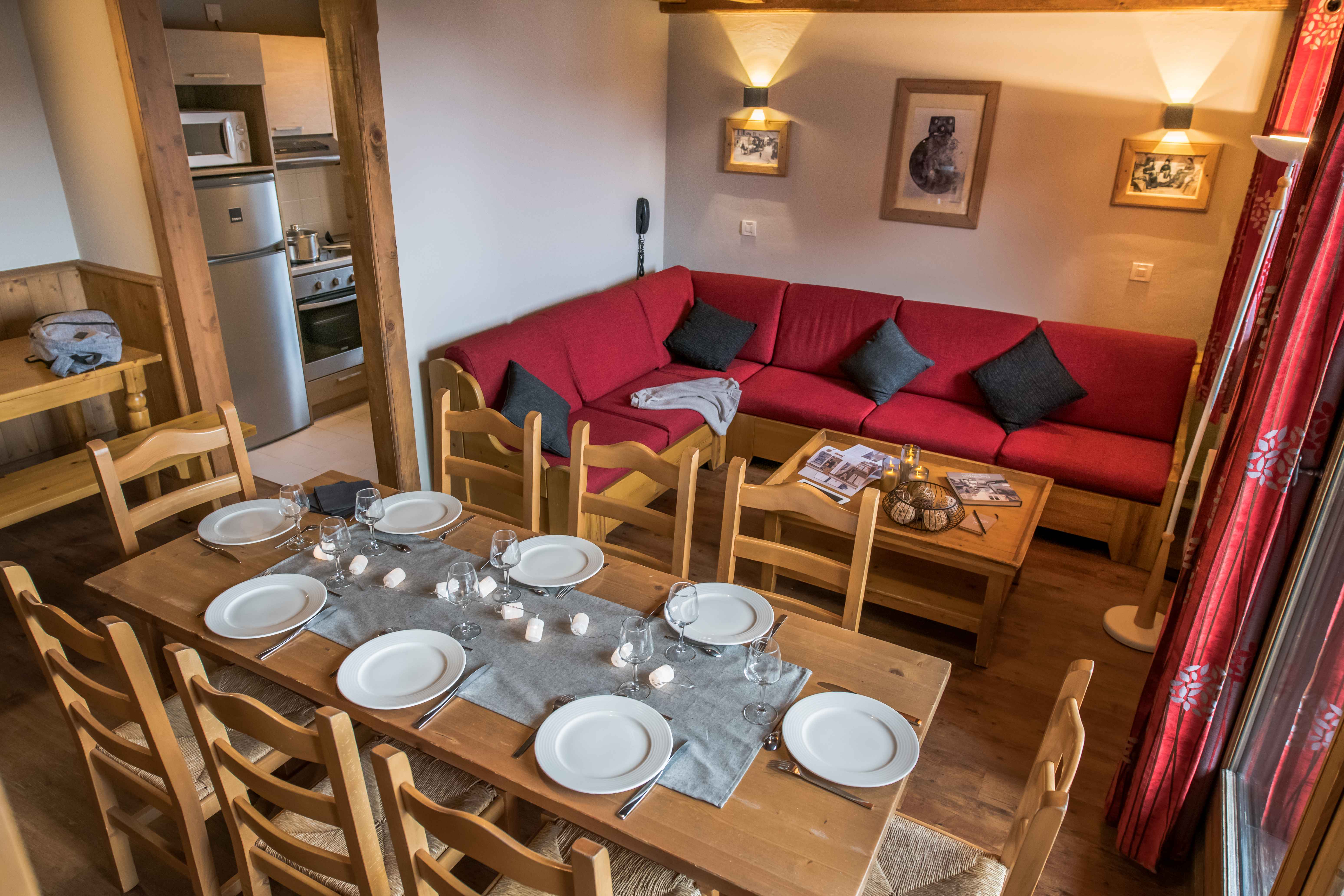image Spacious dining and lounge area with wooden furnishings and ample seating.
