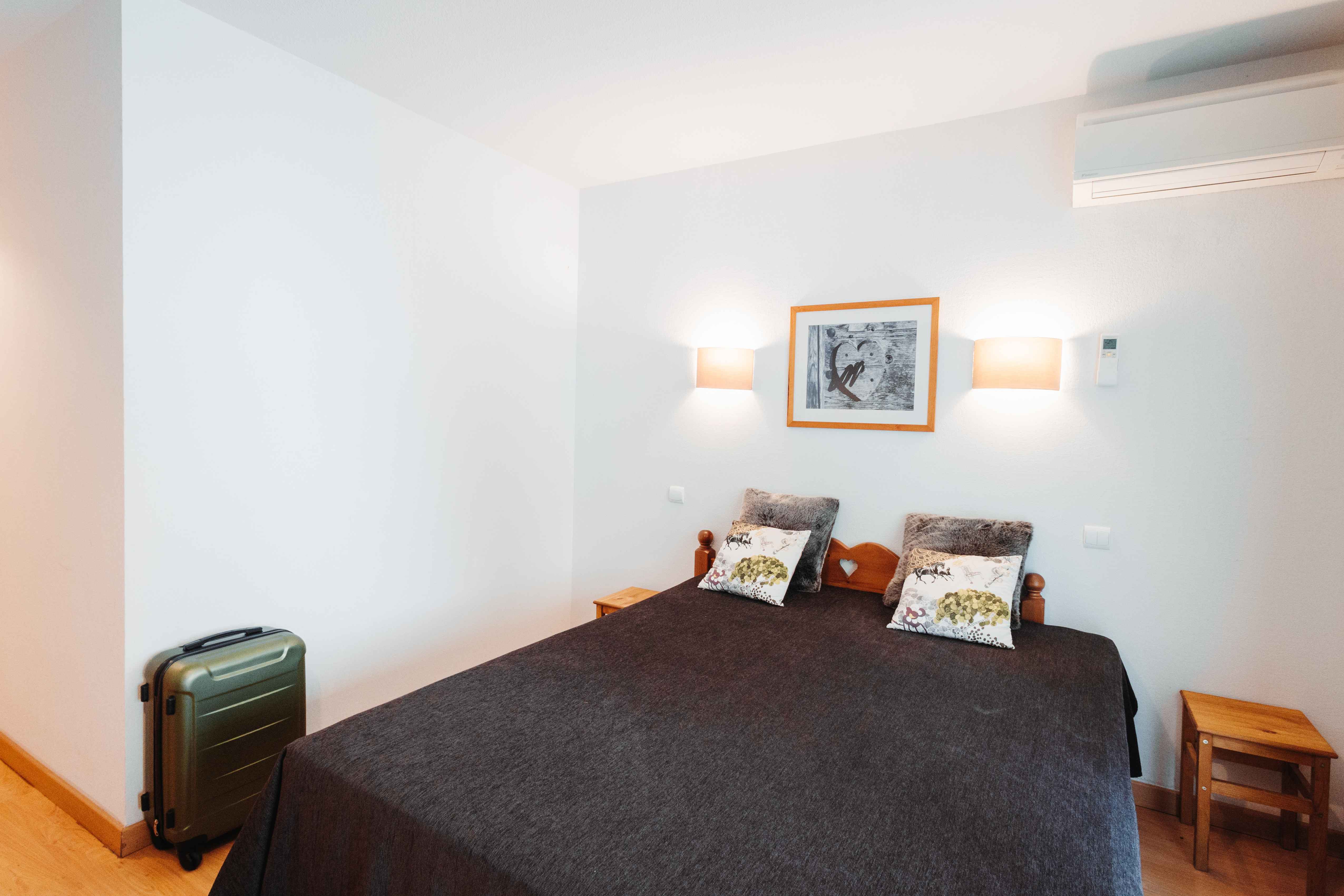 image Sleep peacefully in the cool, air-conditioned bedroom with flexible bedding options.