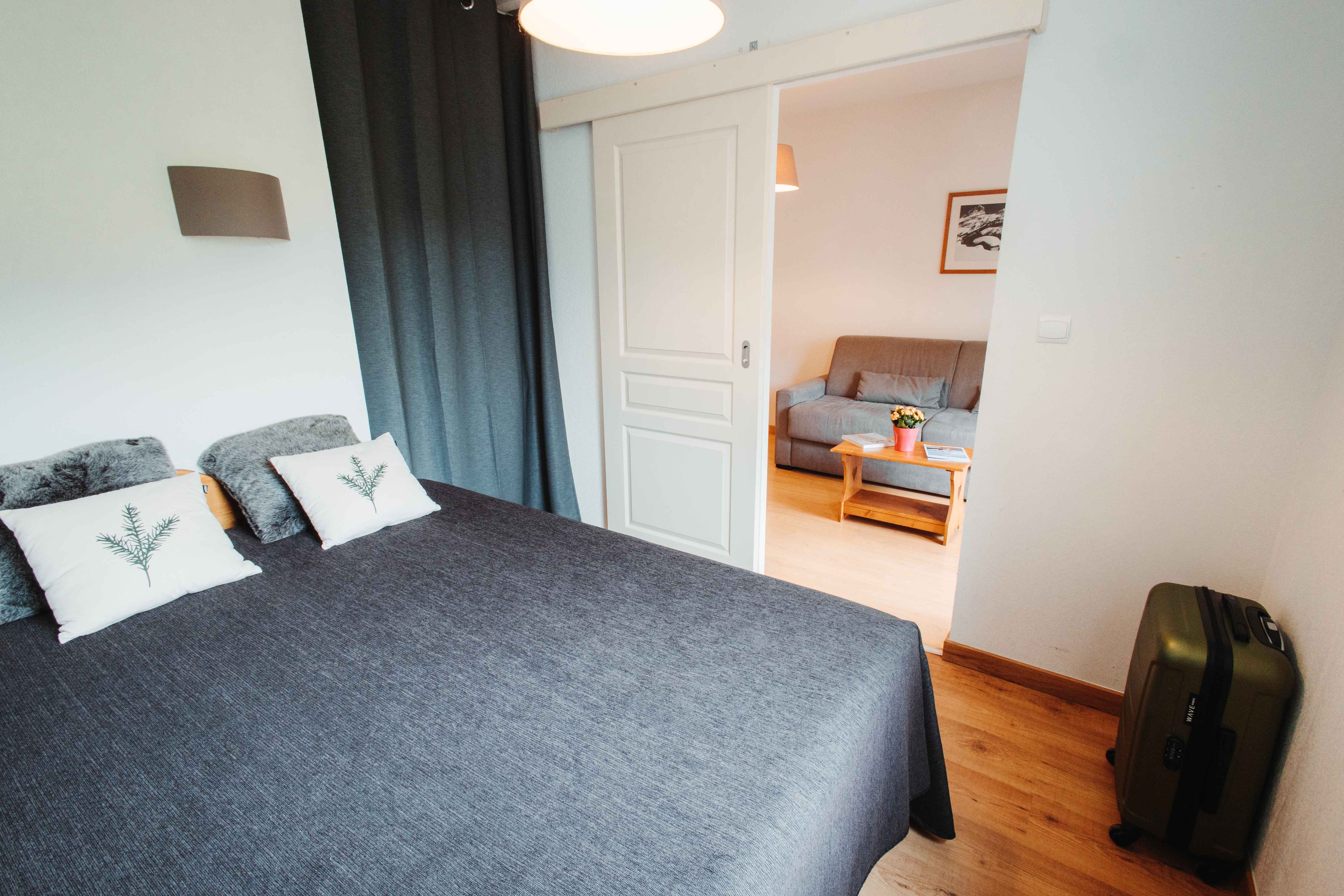 image Rest peacefully in the cosy double bedroom designed for comfort and quiet mountain nights.
