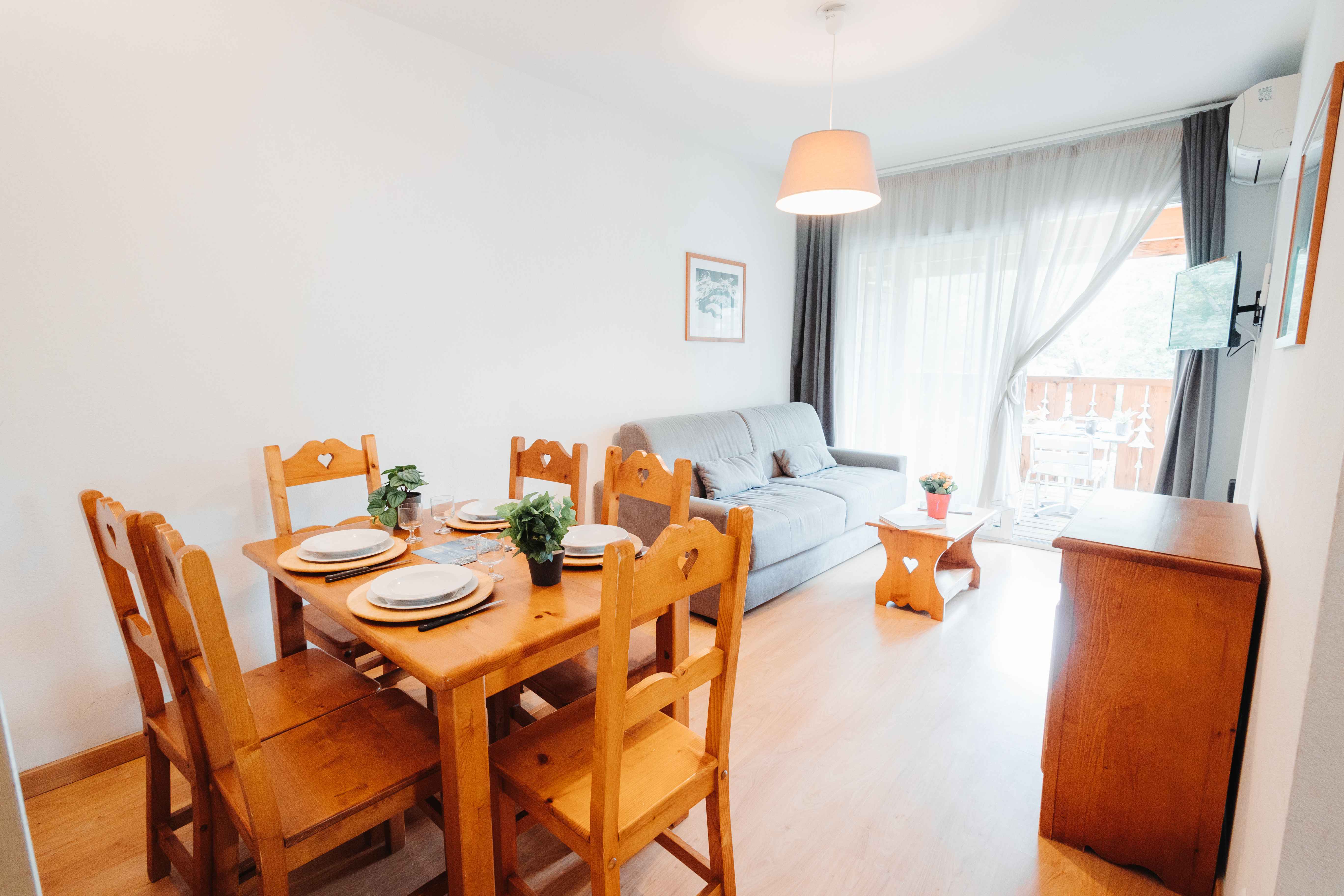 image Bright dining space perfect for sharing meals after alpine adventures in Ax-les-Thermes.