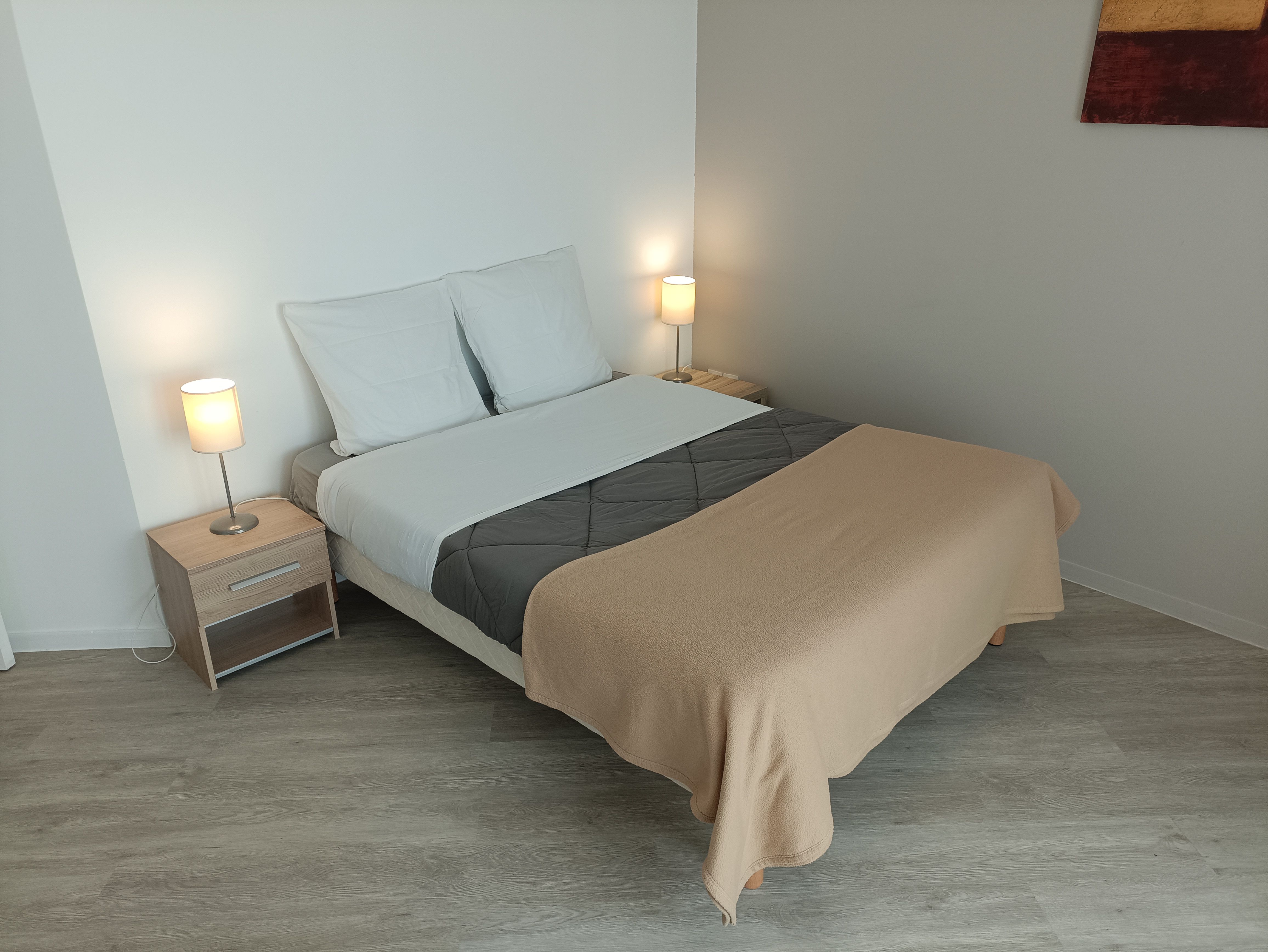 image A tastefully arranged bedroom that combines comfort and elegance, perfect for unwinding after a long day.