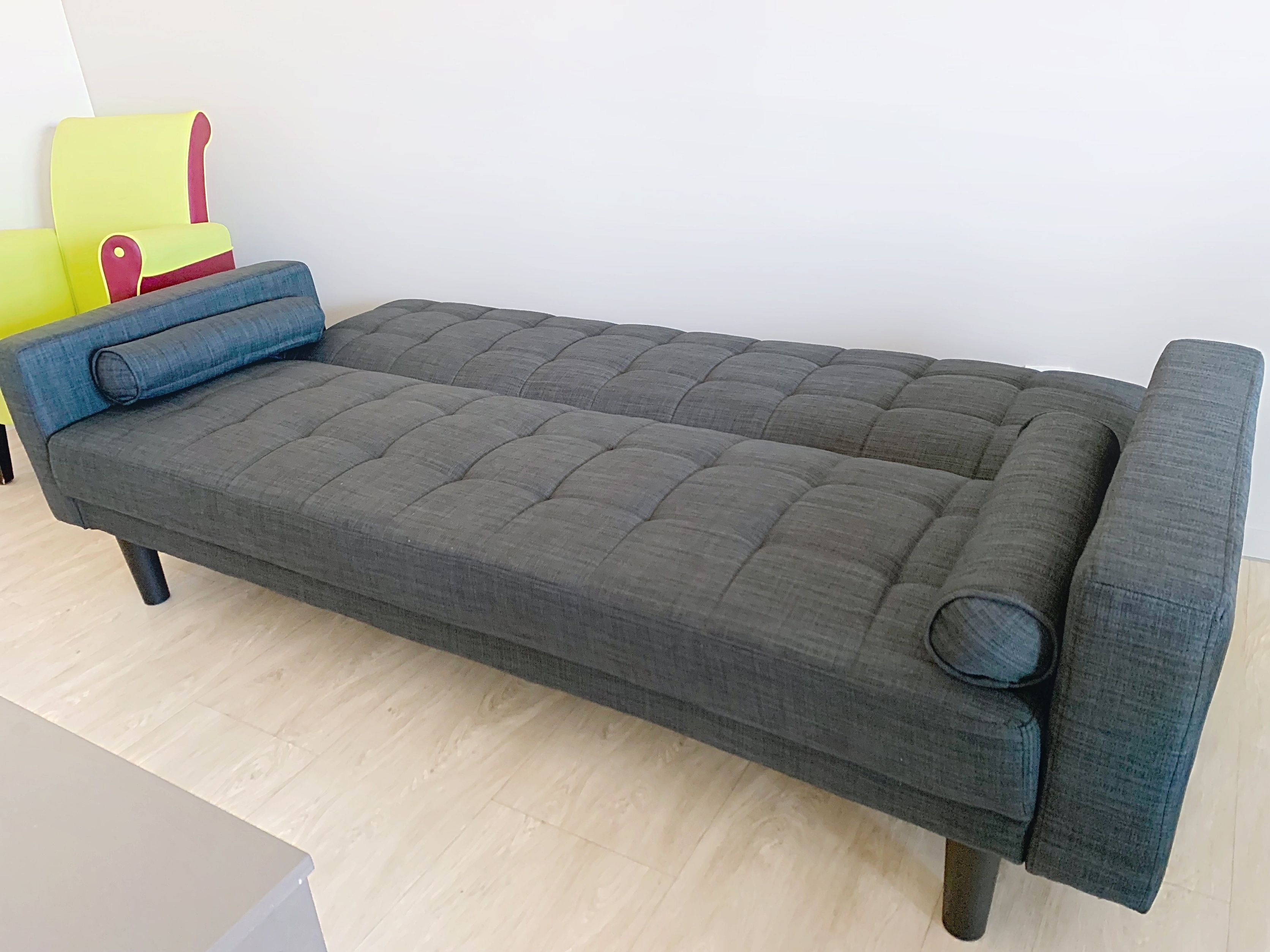 image Comfortable sofa bed in the living room, sleeping one guest in this apartment for 3.