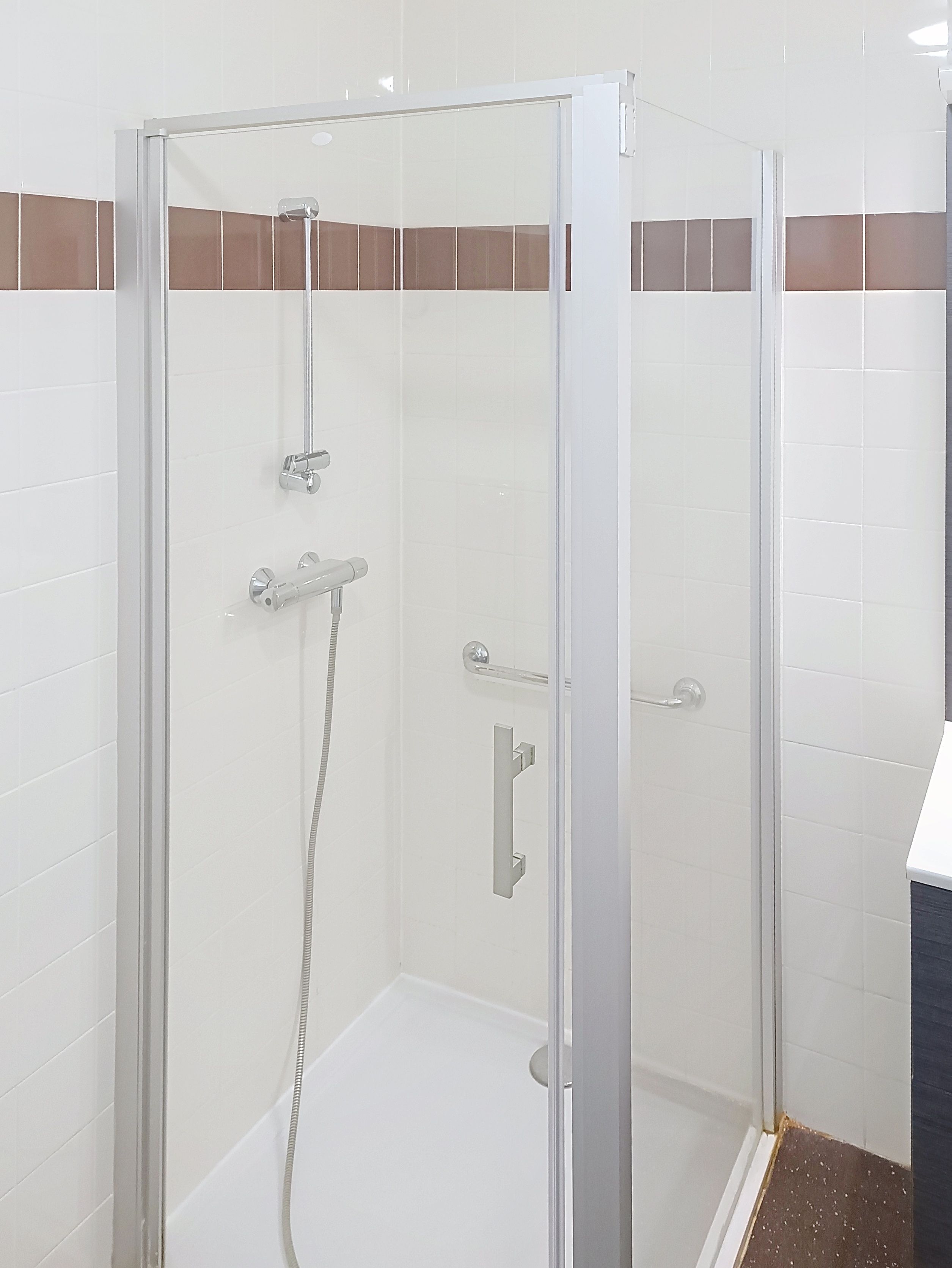 image Bathroom with glass shower enclosure.