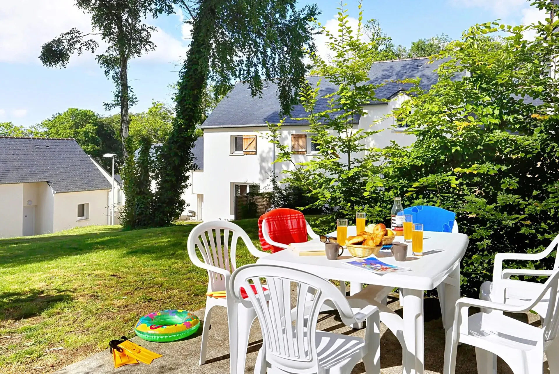image A cheerful outdoor dining setup is perfect for enjoying breakfast among the greenery in the heart of Brittany.