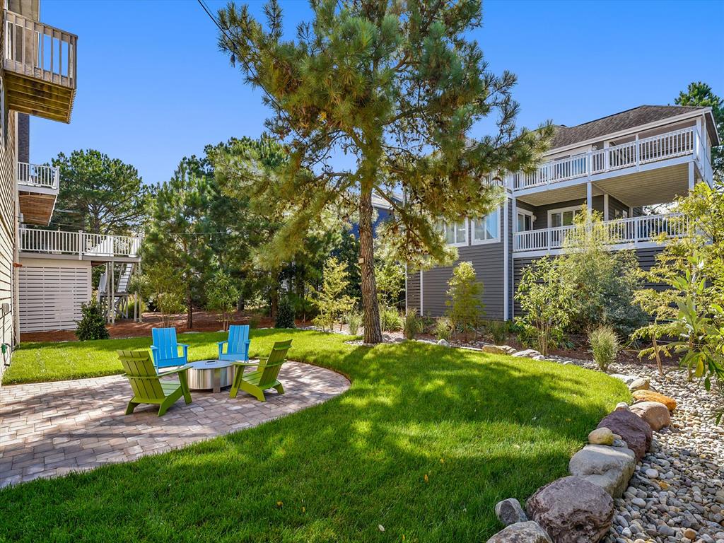 image Sunny backyard lounge area with vibrant chairs, ideal for outdoor relaxation after the beach.