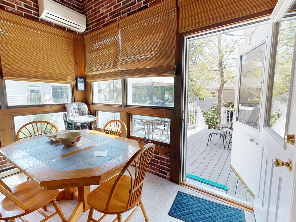 image Enjoy tranquil mornings in the bright sunroom, where natural light and a welcoming vibe make every meal a special gathering.