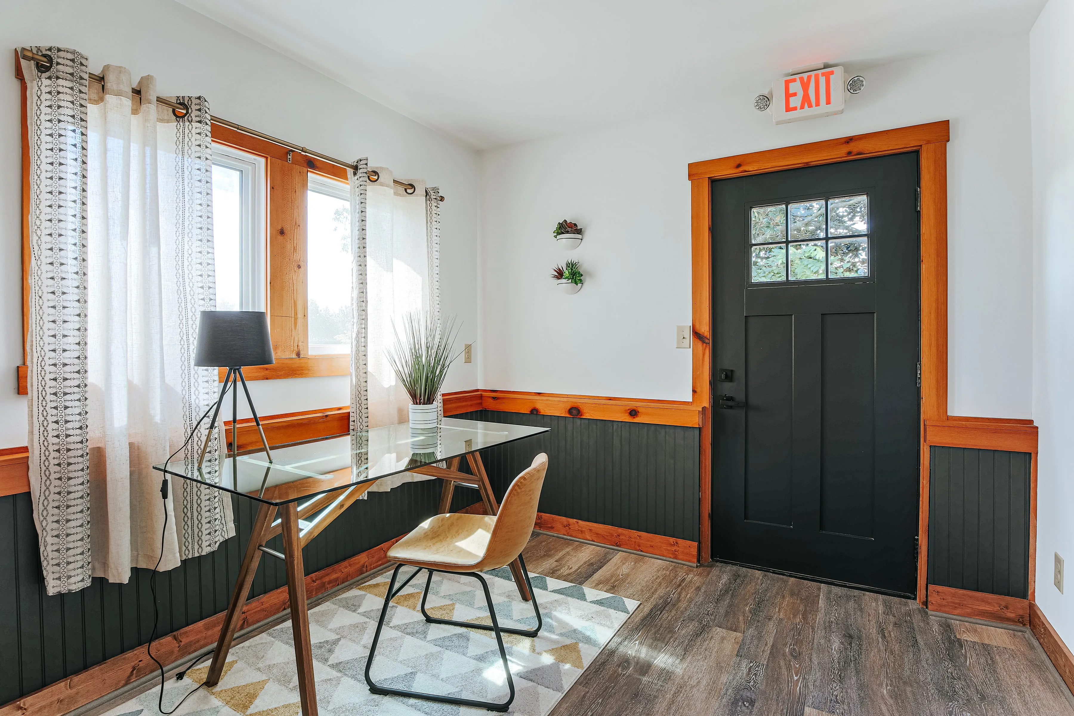 image A dedicated private office space provides a peaceful setting to work or plan your next outdoor excursion, enhanced by natural light and a refreshing view.