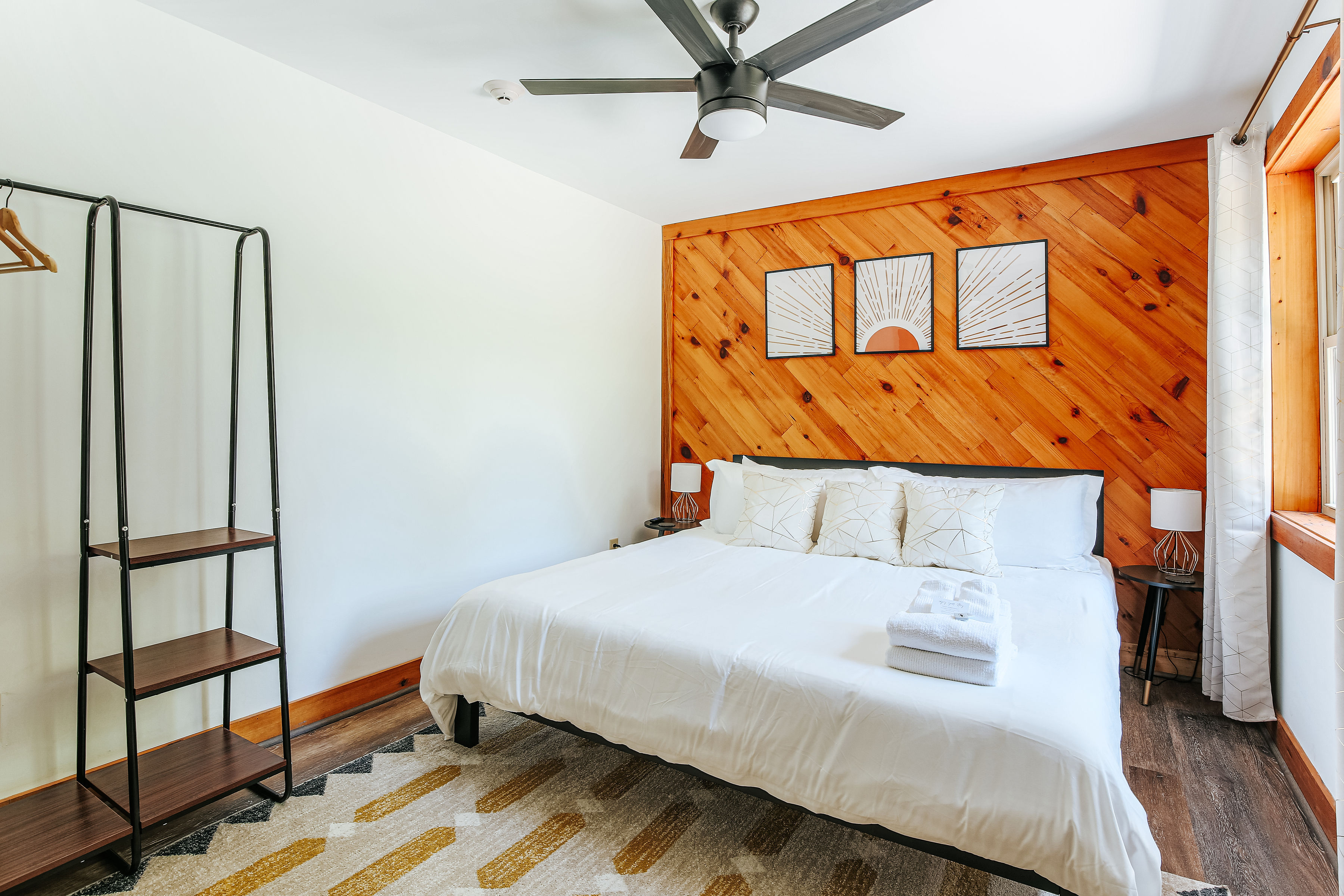 image Inviting king bedroom with stylish decor and ample storage.
