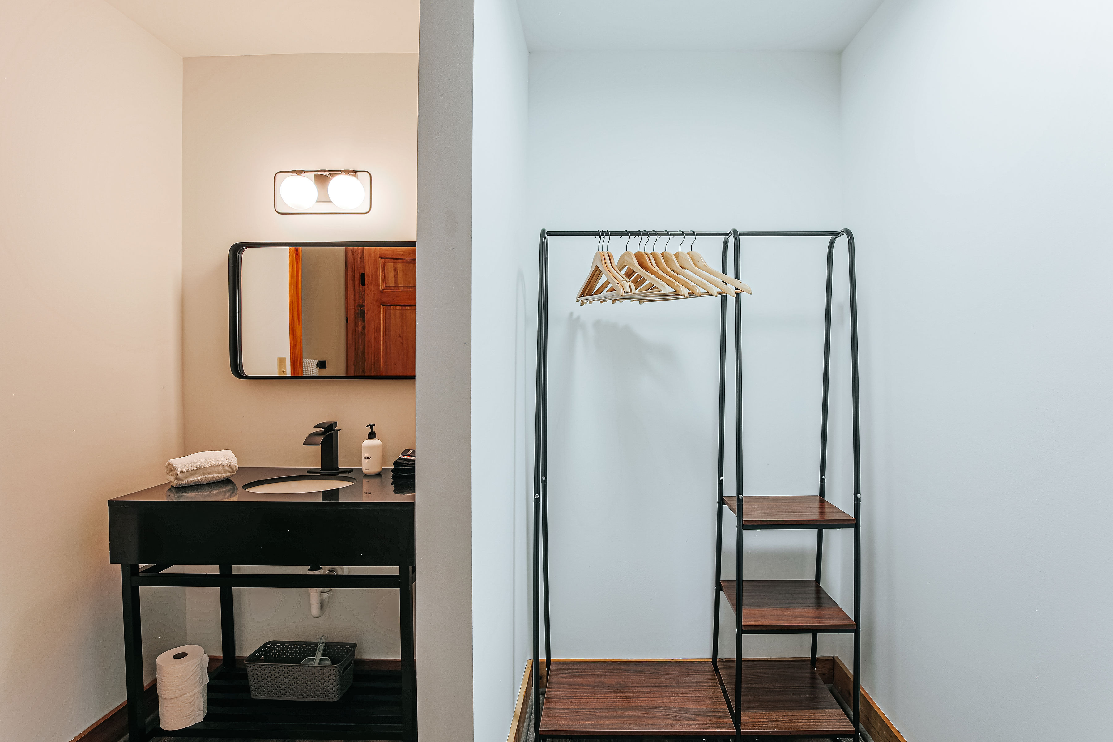 image Dressing area comes with a stylish hanging rack and ample shelving.