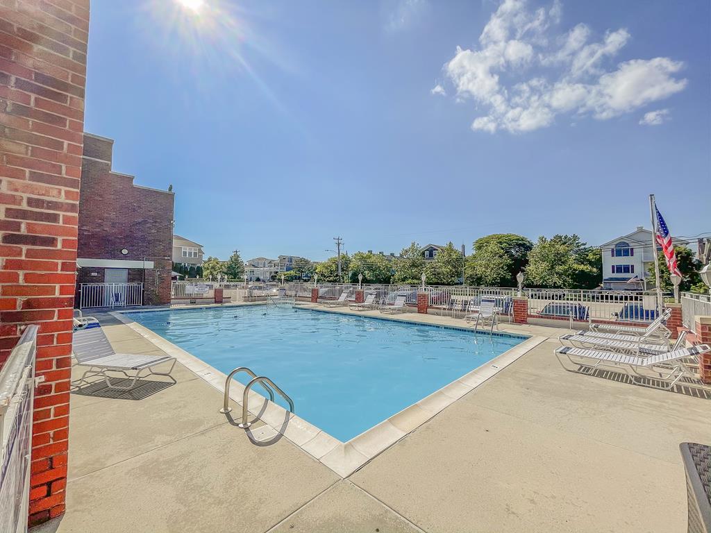 image Heated outdoor pool offers a perfect oasis for summer fun, just steps from your private condo.