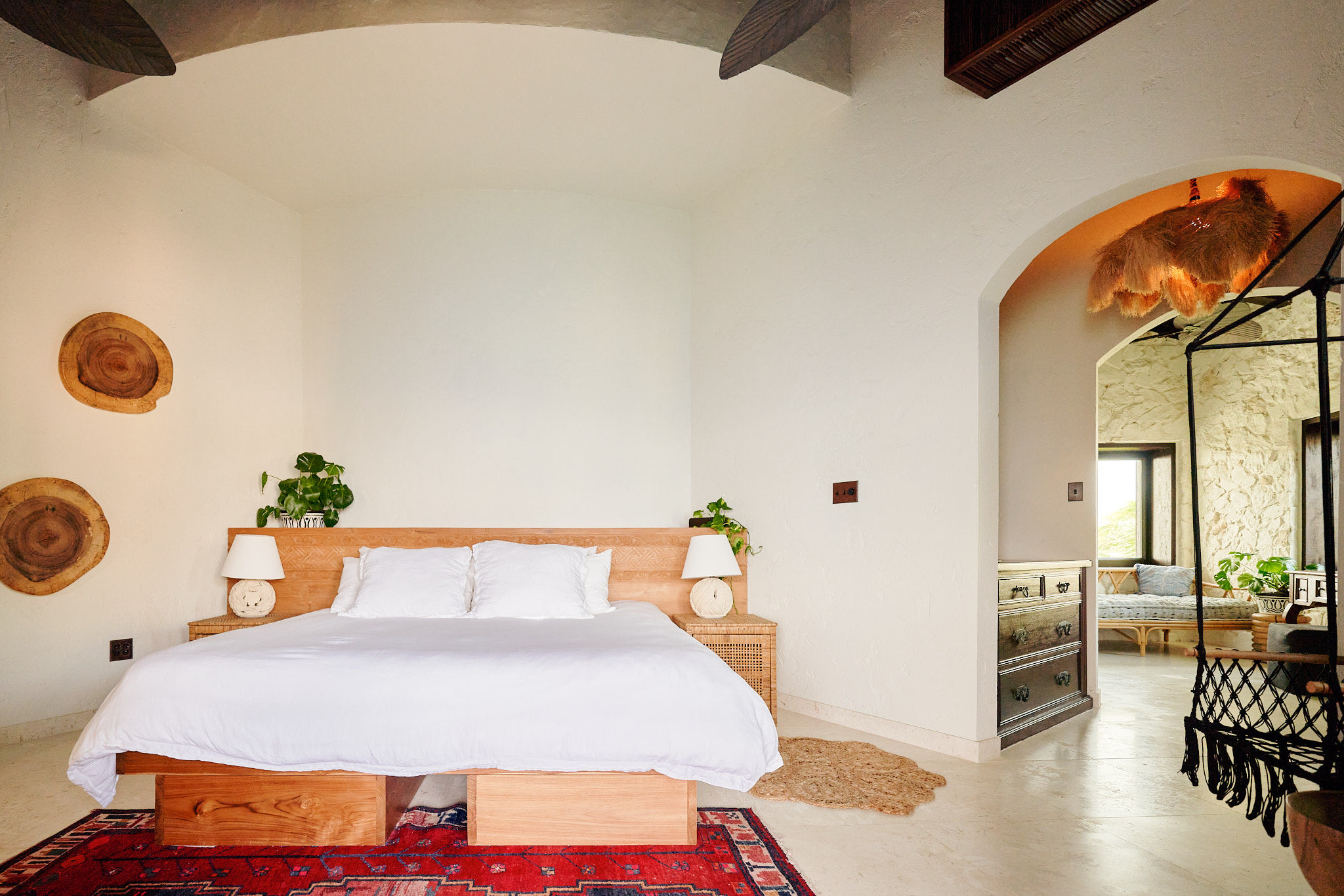 image A bright, serene bedroom featuring warm natural tones and rustic décor.