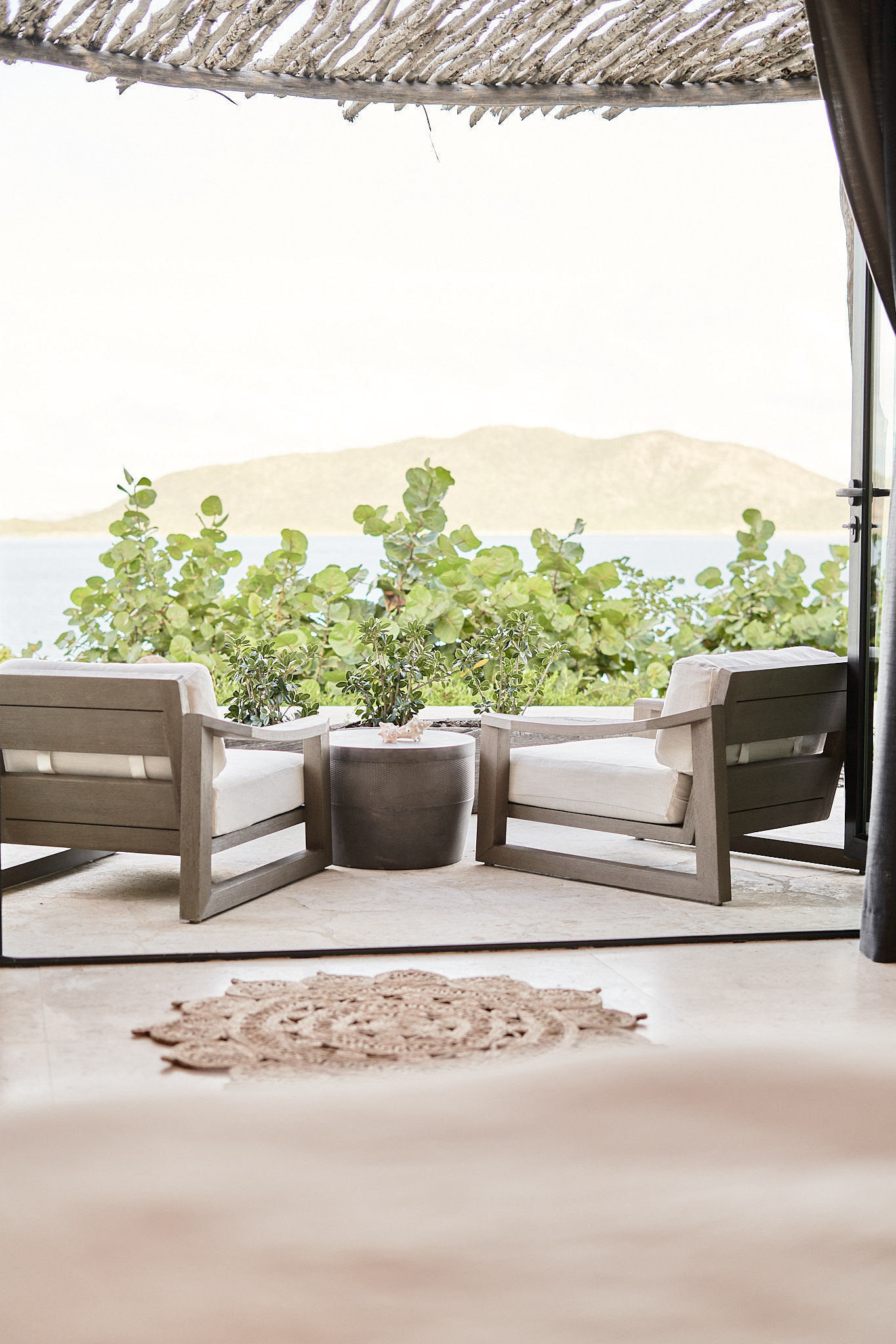 image Shaded outdoor seating area with mountain views and natural textures.