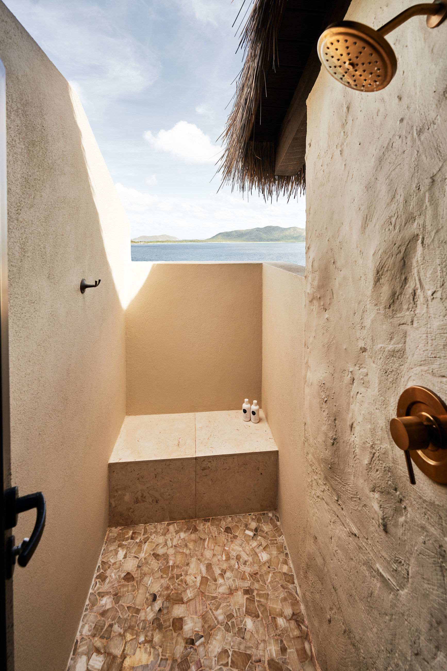 image Refresh in the open-air outdoor shower surrounded by lush tropical gardens and soothing island breezes.