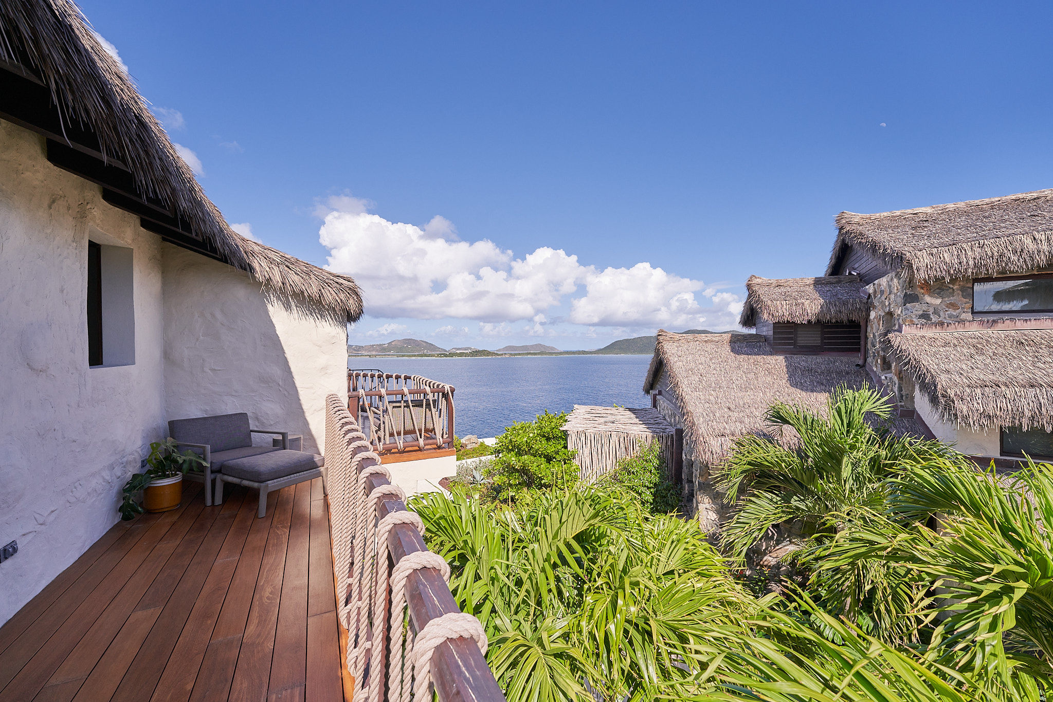 image Private rooftop terrace with panoramic views and lush tropical surroundings.