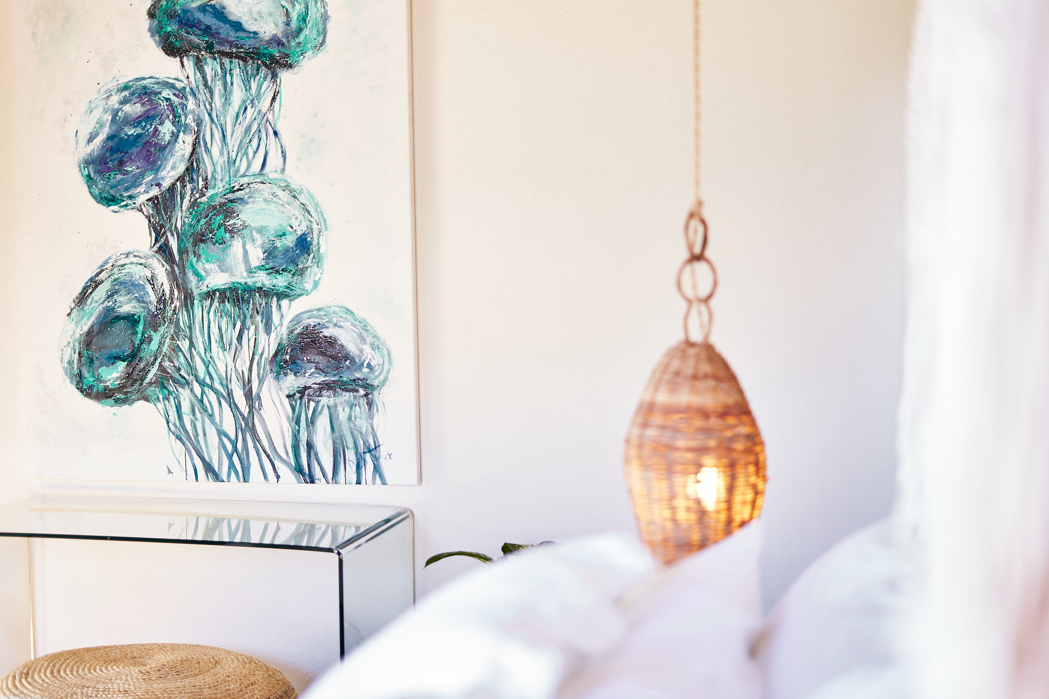 image A closer look at the cozy bedroom corner featuring artistic décor and soothing natural textures.