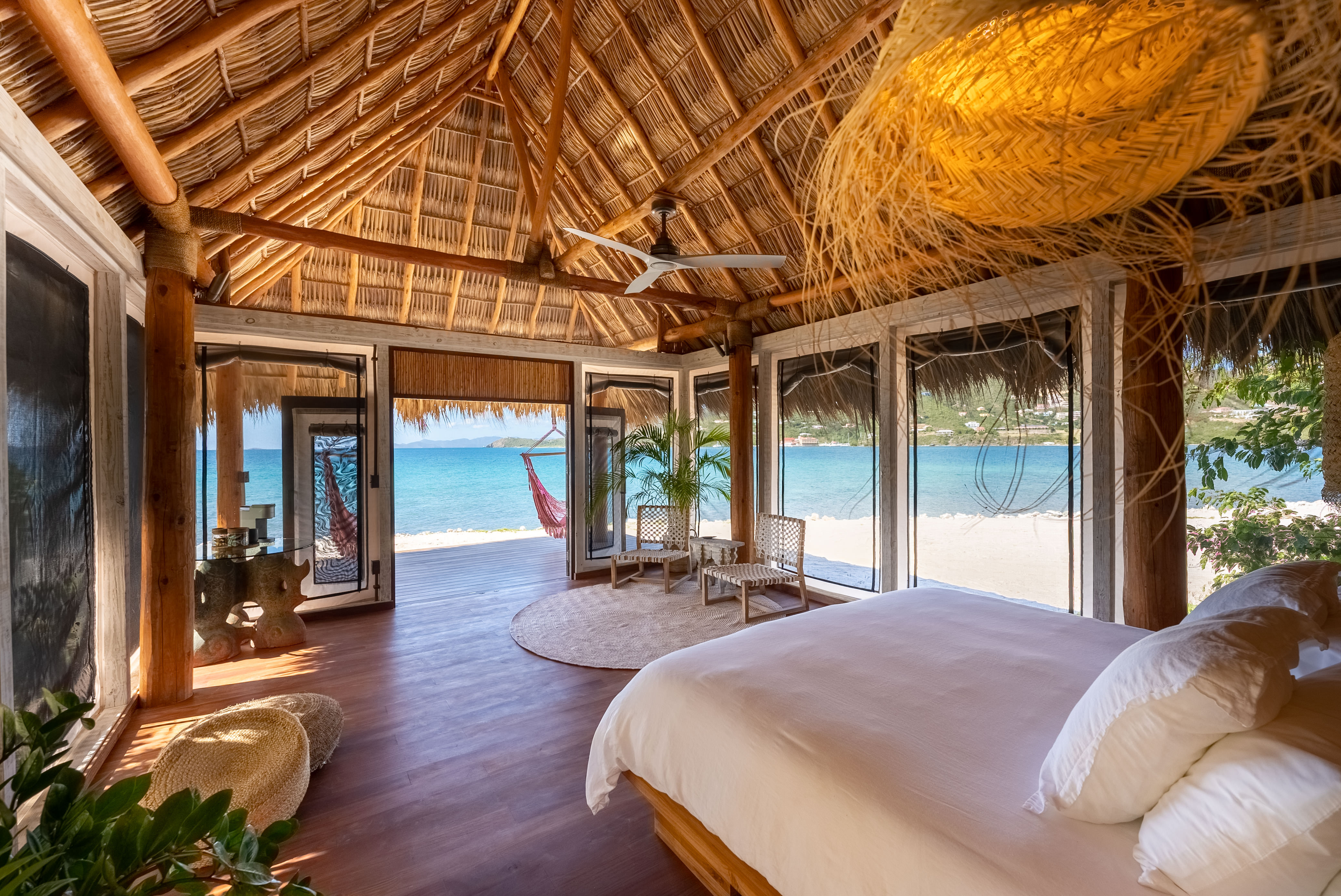 image Open-air unit with vaulted ceiling, panoramic windows, and uninterrupted ocean views.
