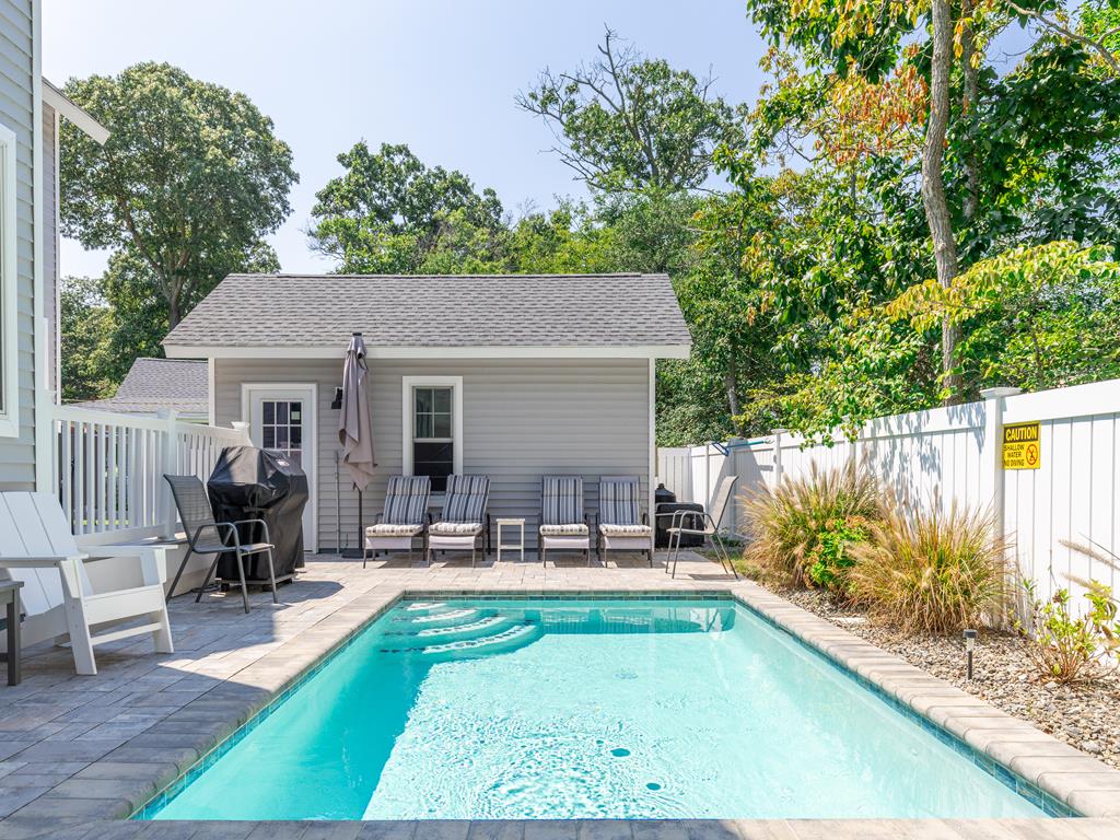 image Glistening heated pool open May through October—your private oasis for daytime dips and evening swims.