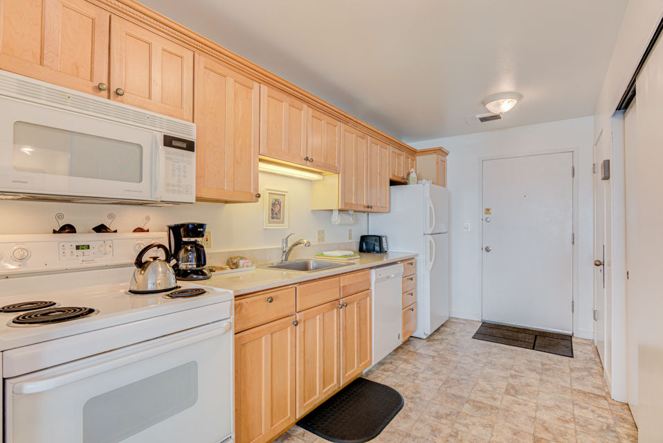 image This kitchen offers modern appliances and ample storage, providing convenience for preparing meals during your stay.