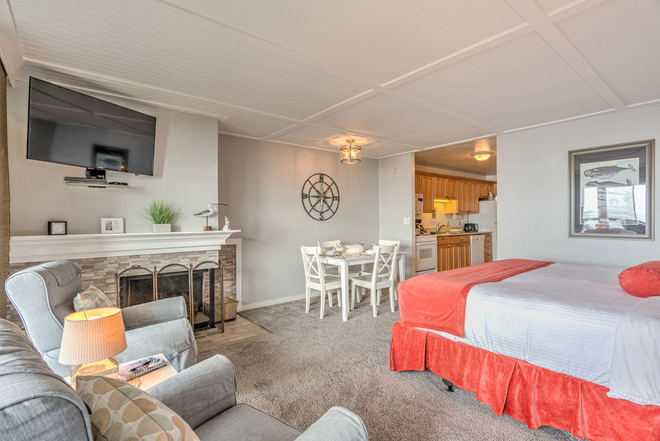 image The King Bed Studio features a plush king bed and an inviting seating area, perfect for relaxation near the cozy fireplace.