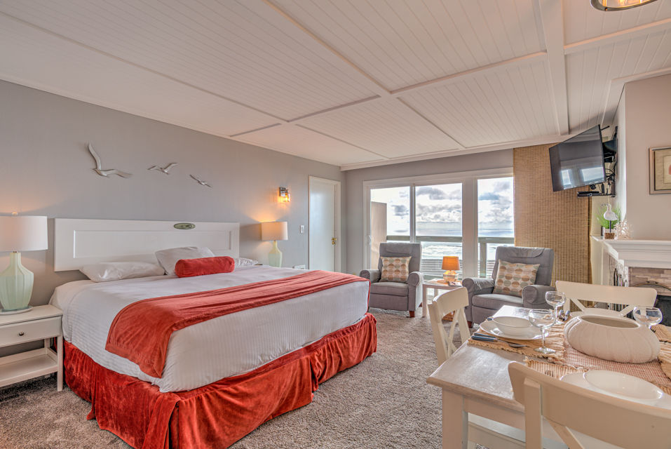 image Experience the serene ambiance of this King Bed Studio, featuring a comfortable king bed and picturesque ocean views, perfect for a cozy resort-style getaway.