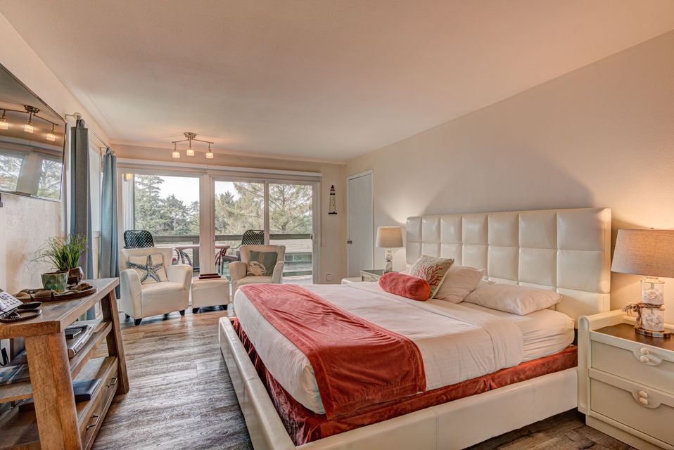 image Experience coastal tranquility in this inviting 1 King Bedroom featuring a spacious king bed and an ocean-view balcony perfect for morning coffee.