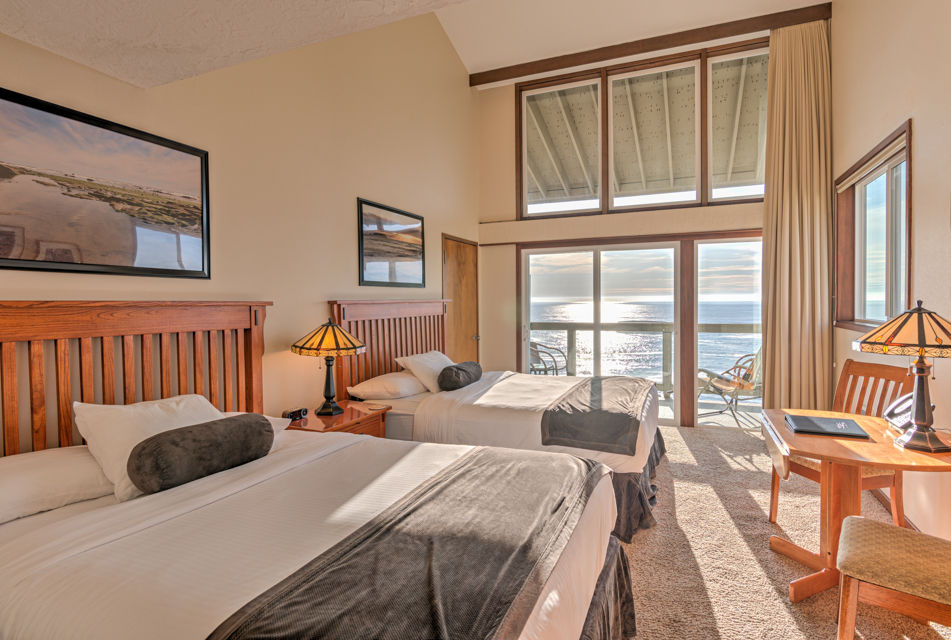 image This charming 2 Queen Bedroom features two cozy queen beds, a panoramic balcony with stunning ocean views, and a relaxing sitting area for added comfort.