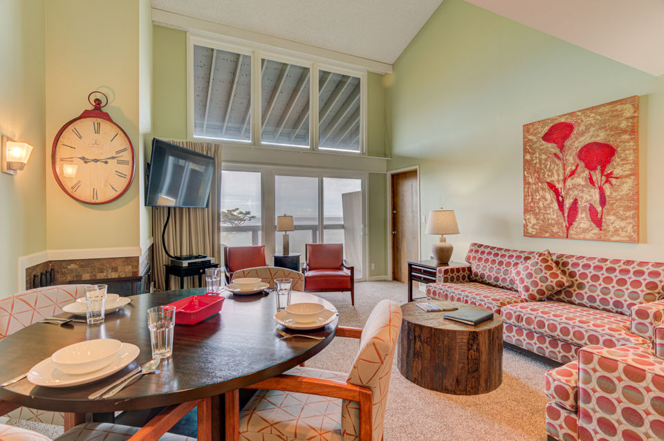 image Step into the open dining area and living space, where panoramic views of the ocean are framed by large windows, creating a perfect setting for gatherings.