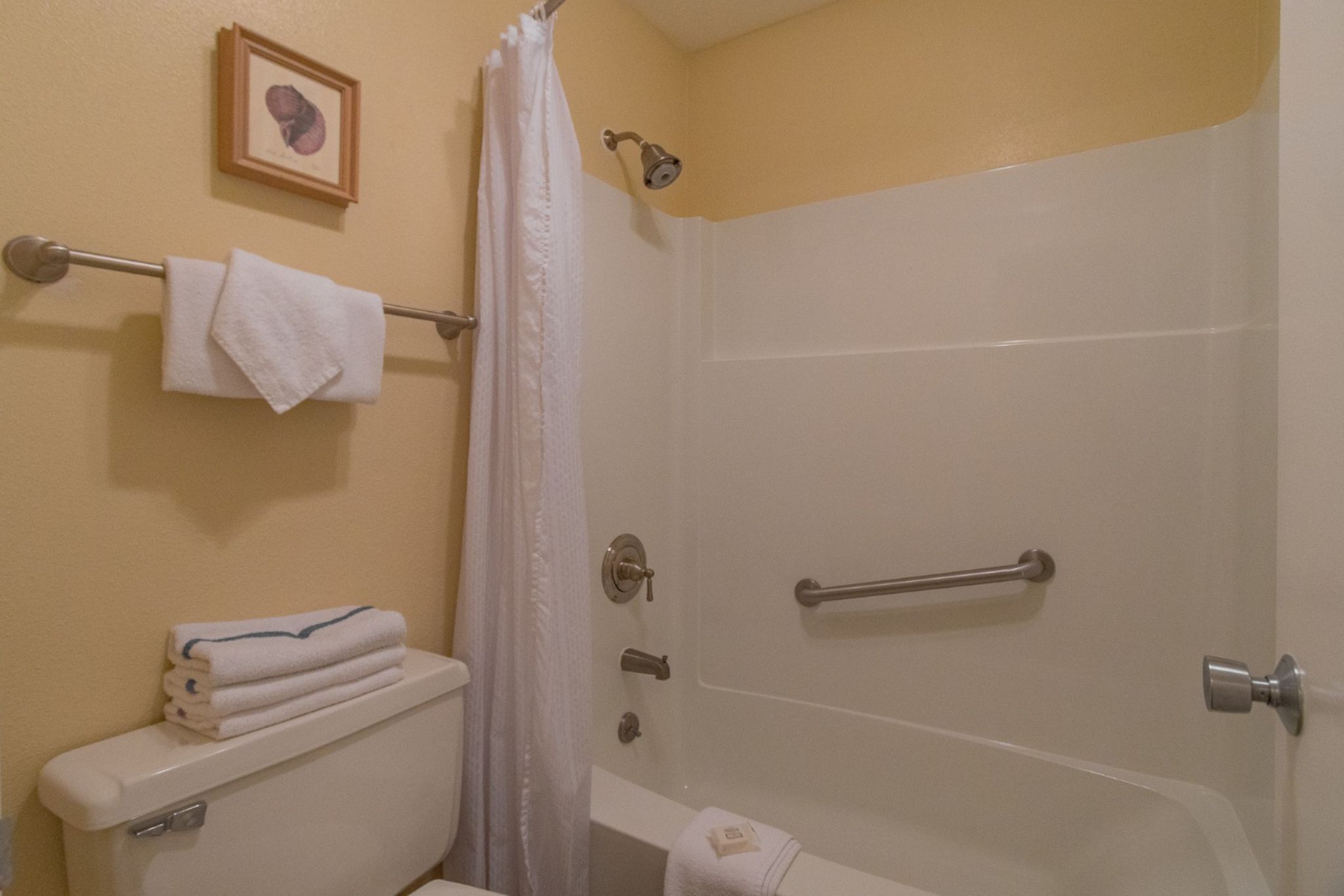 image The bathroom features a clean and functional design with essential amenities for your convenience.