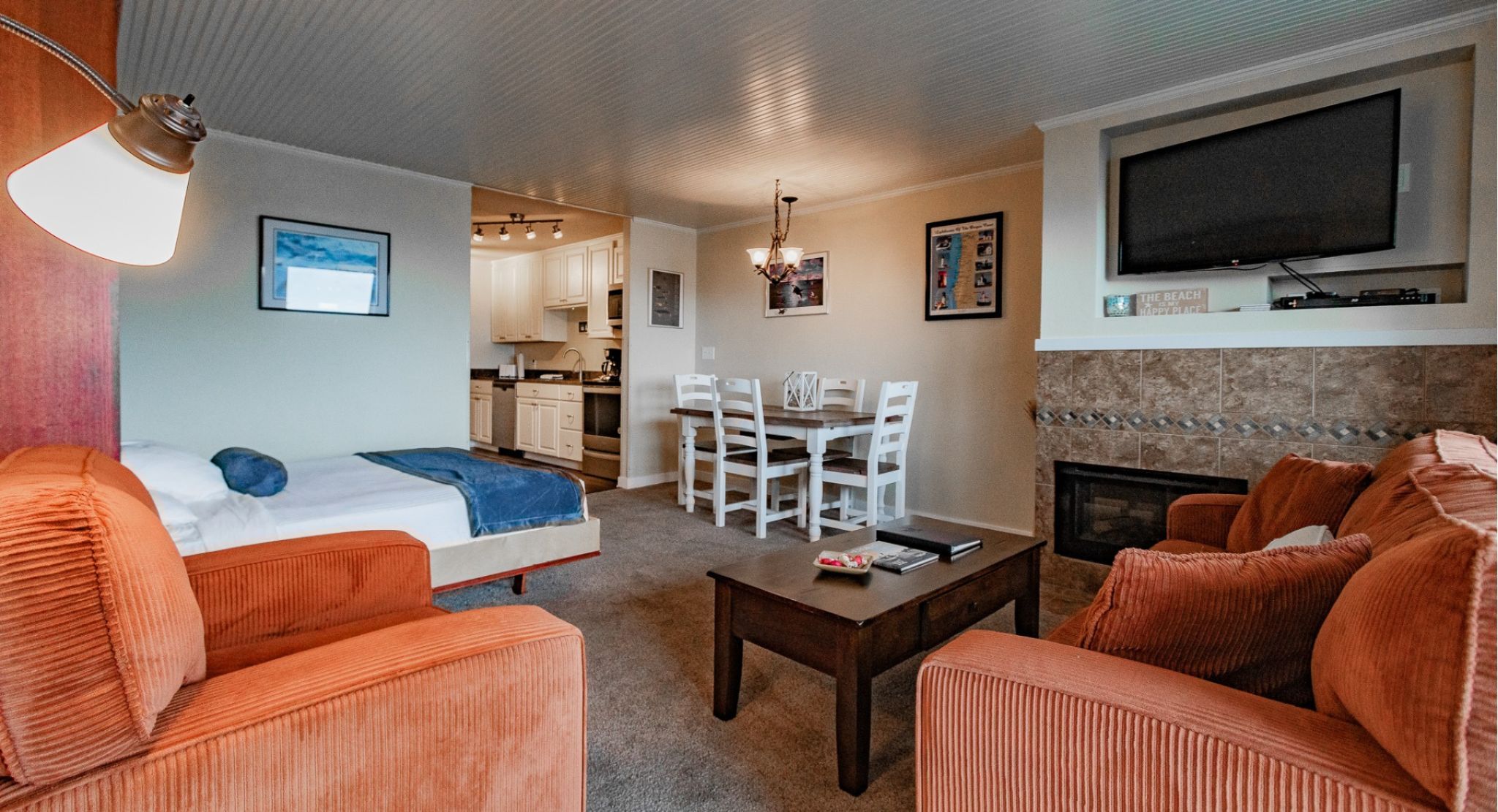 image The inviting living space showcases a dining area and full kitchen, ideal for enjoying meals in the comfort of your studio.