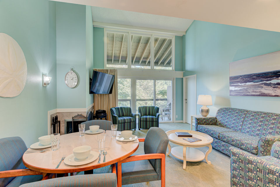 image The dining area and living space are perfectly designed for relaxation and gatherings, offering easy access to the balcony with forest views.