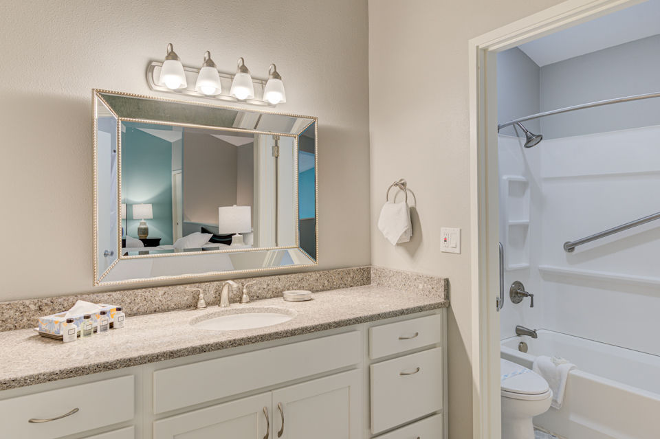 image The modern bathroom is equipped with sleek fixtures, adding a touch of luxury to your stay.