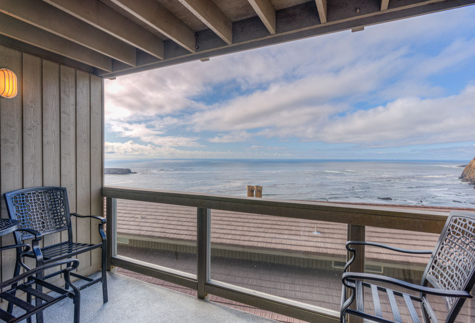 image The ocean-view balcony provides a serene outdoor space with comfortable seating, ideal for savoring morning coffee or watching the sunset over the water.