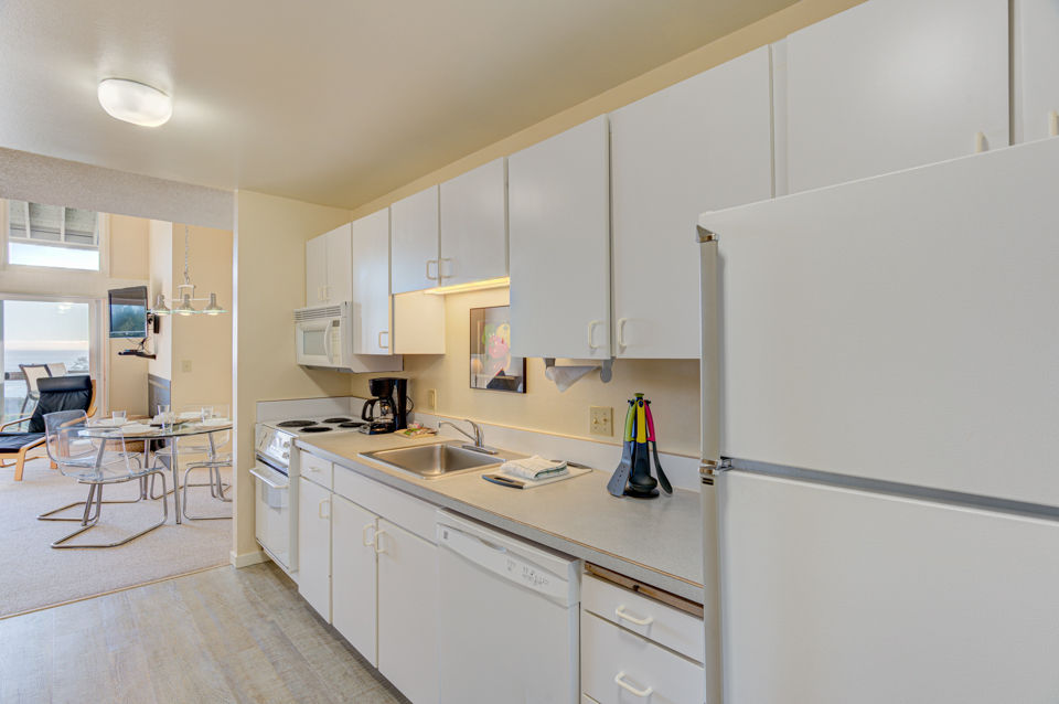image The full kitchen is equipped with modern appliances, providing the convenience of home-cooked meals while enjoying your stay at the inn.