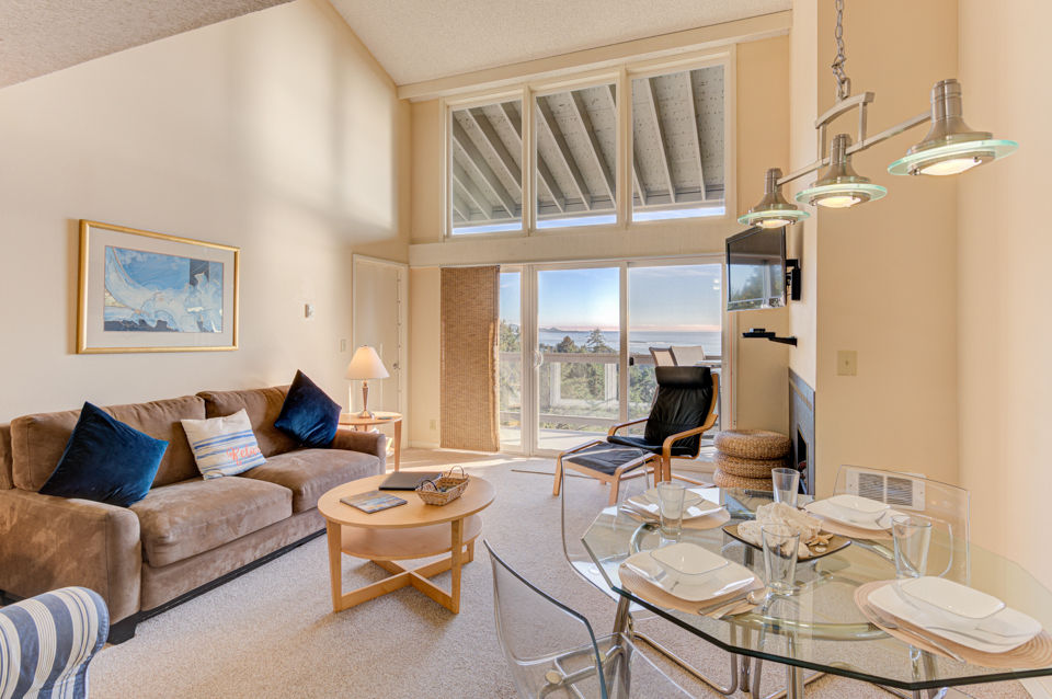 image Natural light floods the living area, revealing stunning ocean vistas and a welcoming setup, perfect for relaxation or entertaining.