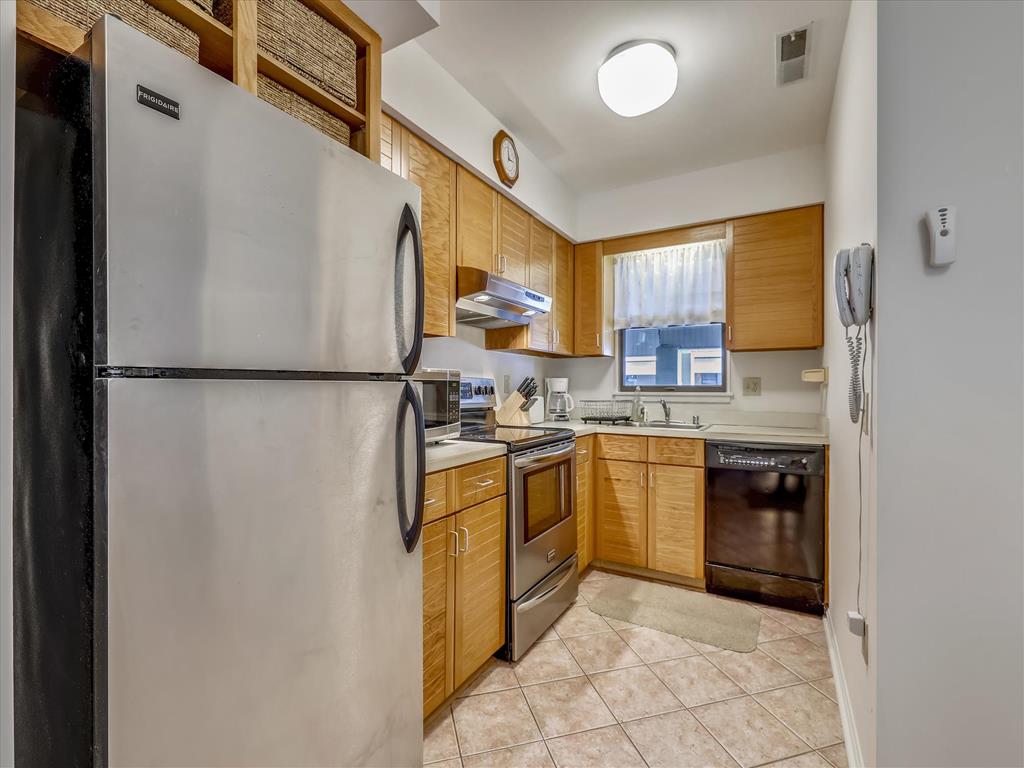 image Cook up a storm in the well-equipped kitchen, featuring modern appliances and plenty of counter space.