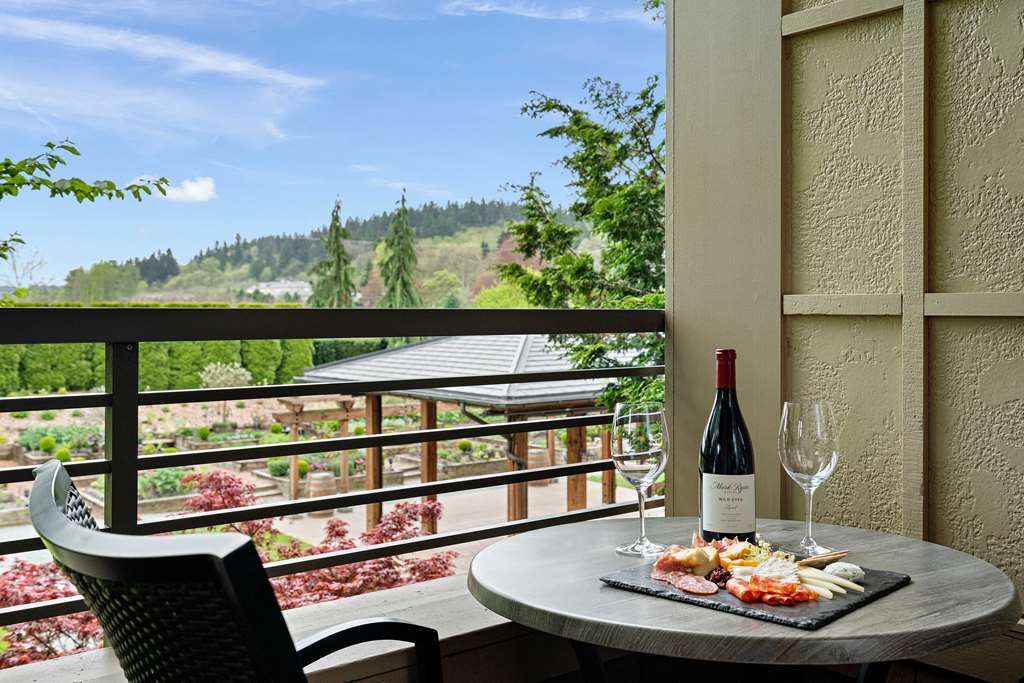 image Private balcony with garden views sets the scene for lingering moments over wine and local flavors.