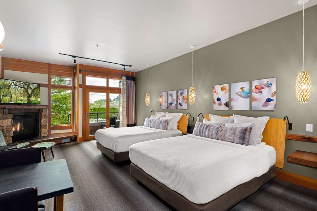 image Spacious room with two plush beds offers comfort and style for families and friends alike.