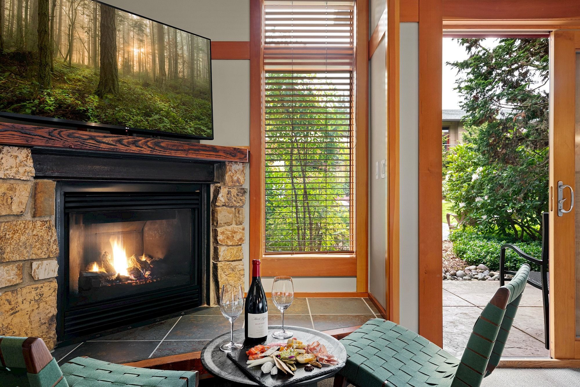 image Fireplace with views of the balcony invites peaceful moments surrounded by wine country charm.
