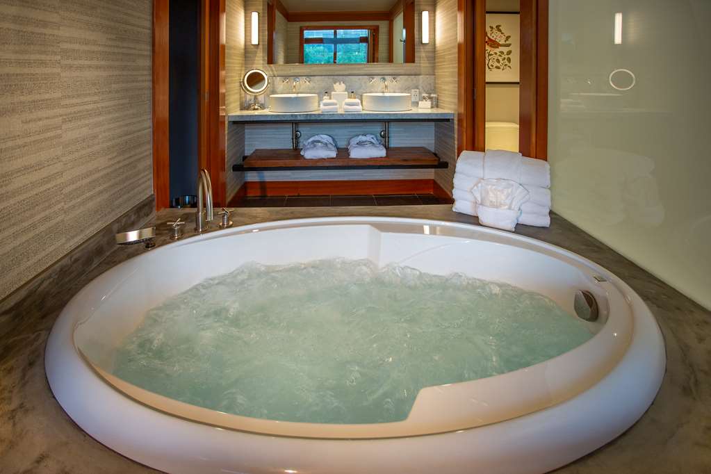 image Jacuzzi bathtub surrounded by calming tones sets the stage for pure relaxation.
