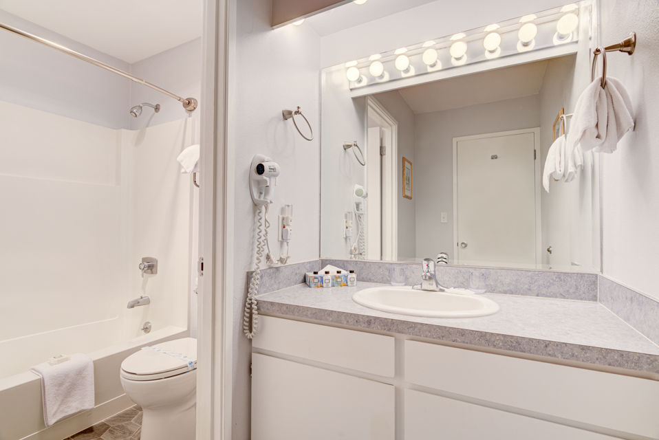 image The well-appointed bathroom features modern fixtures and finishes, providing a comfortable space for relaxation after a day spent enjoying the stunning coastal scenery.
