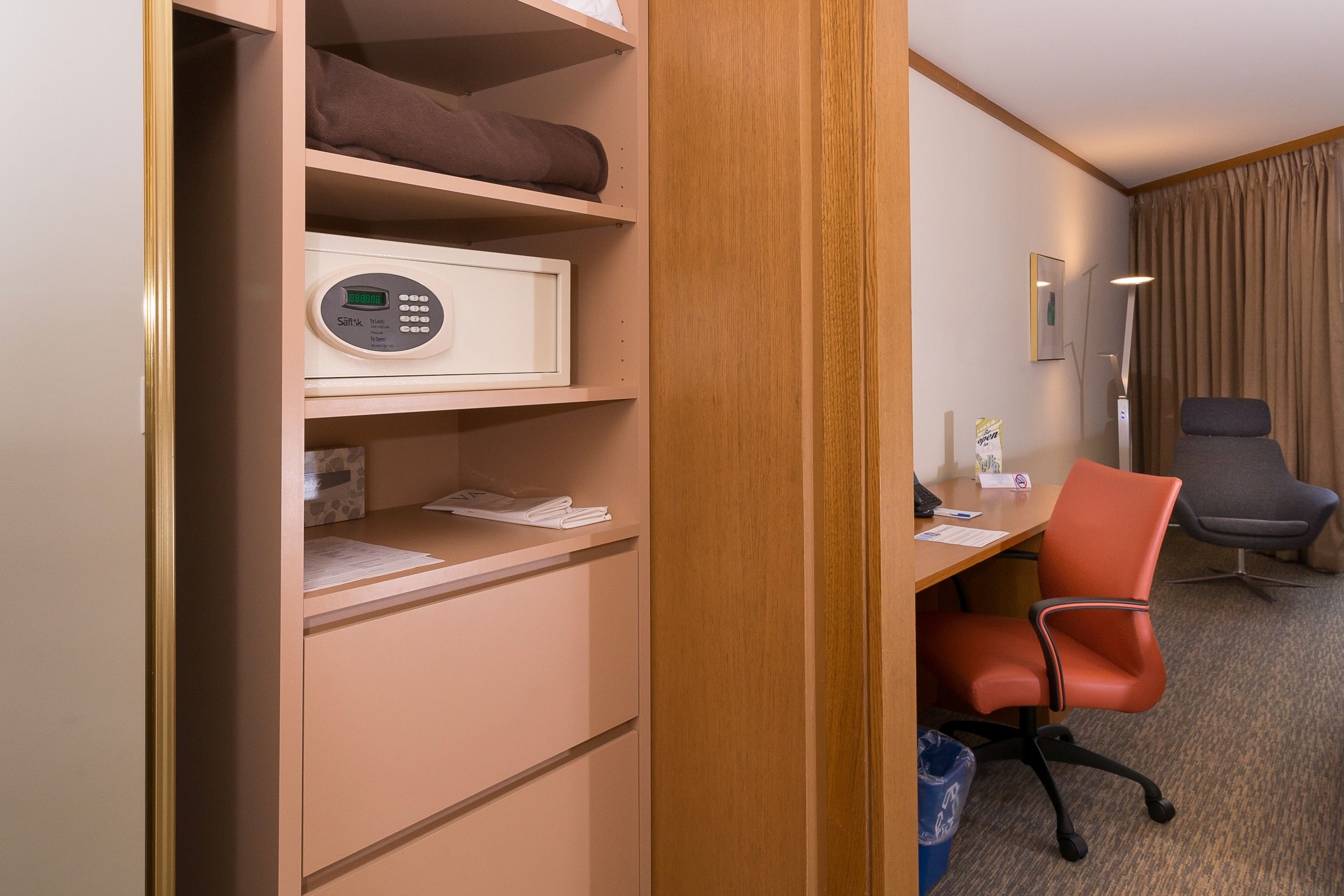 image Discover ample storage solutions in the cleverly designed closet area, equipped with shelving, a safe, and easy access to your essentials while enjoying your stay.