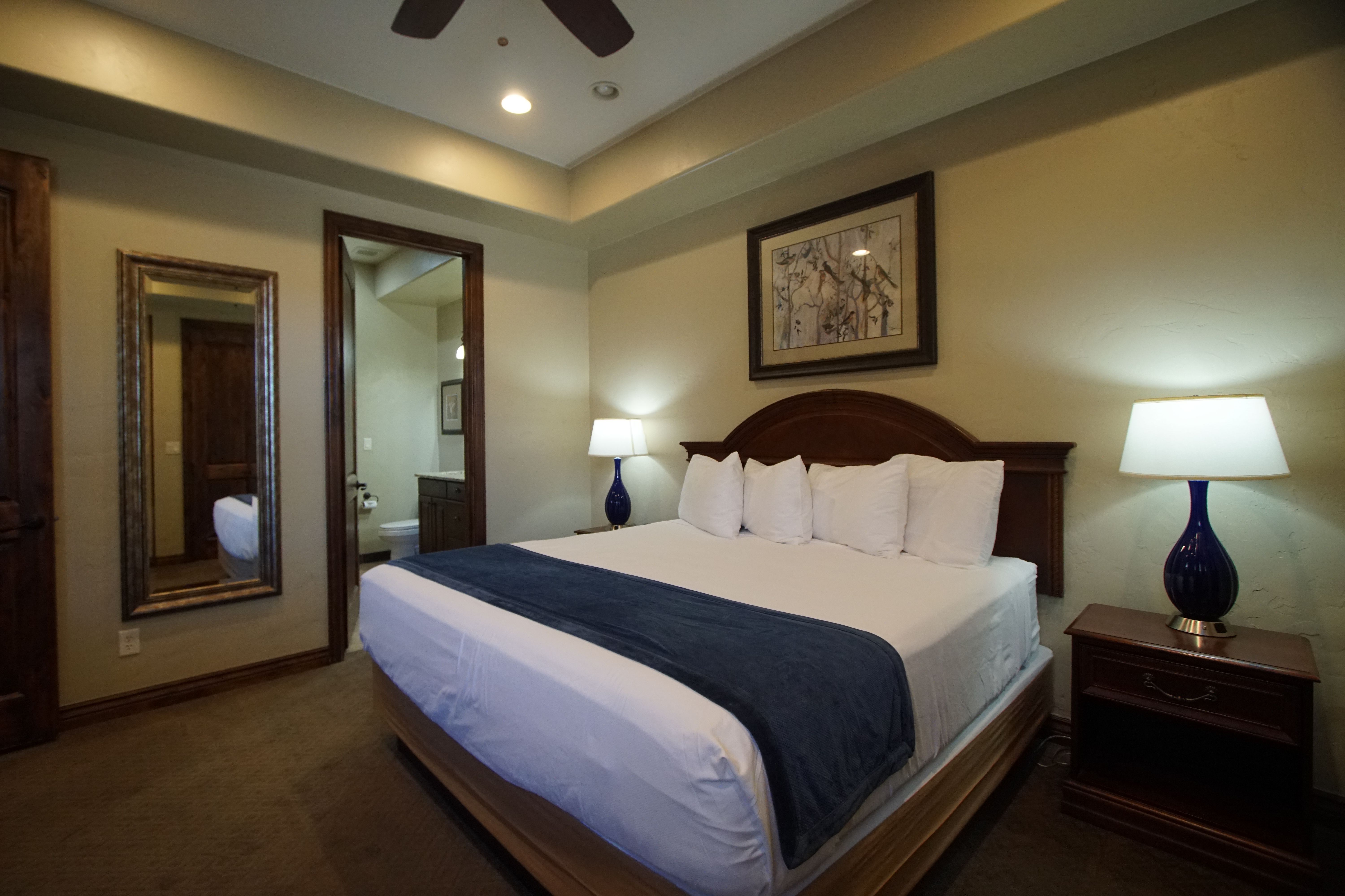 image Spacious primary bedroom with king bed, soft lighting, and relaxing décor.